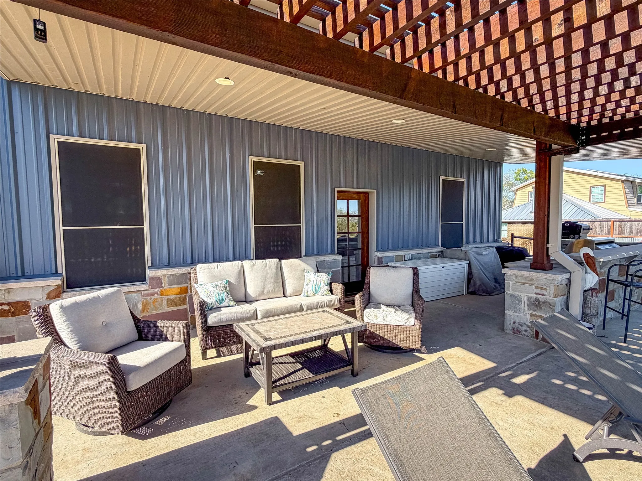View of patio / terrace with a pergola, an outdoor living space, and a grill