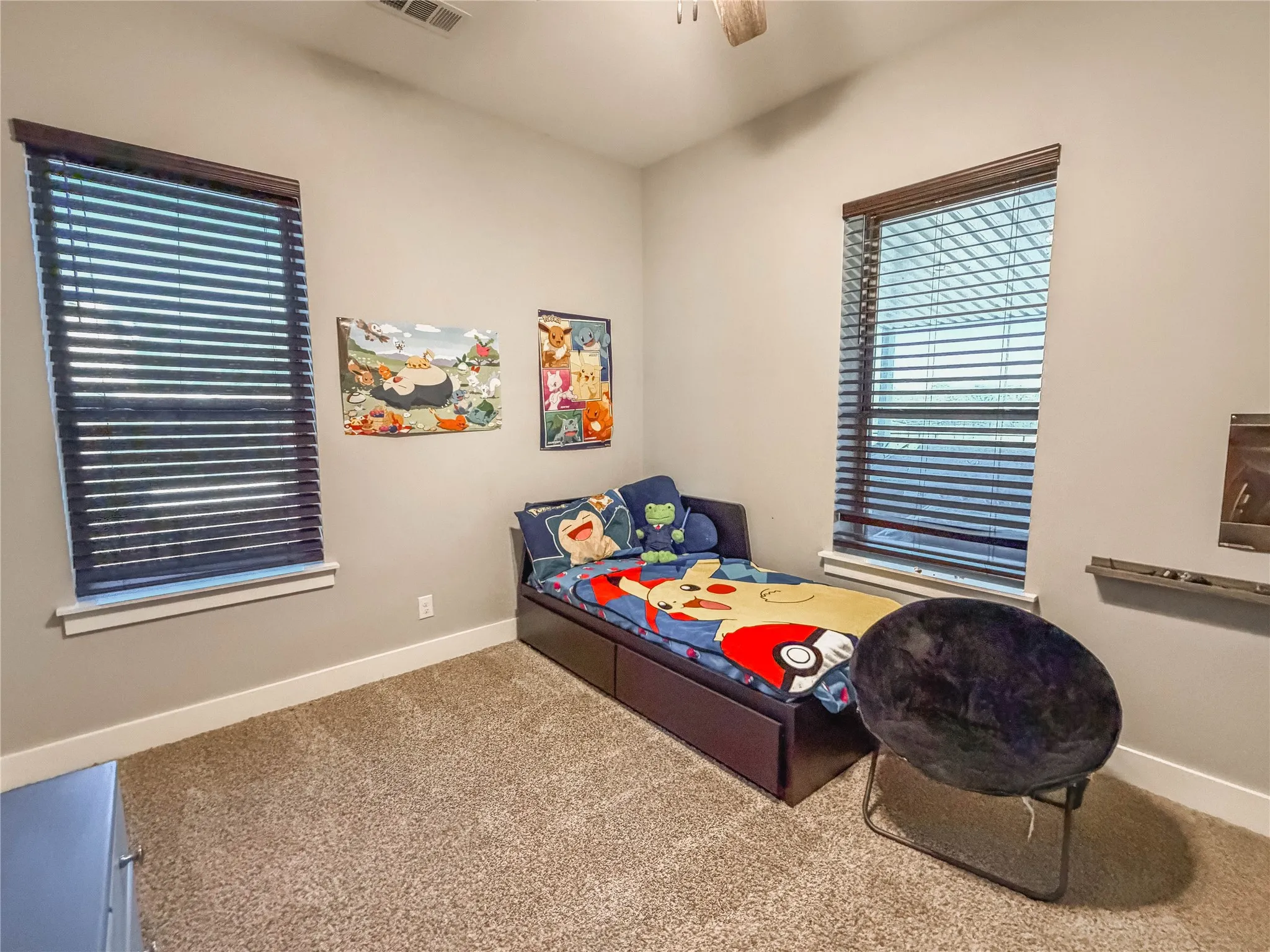 Bedroom with carpet floors and a ceiling fan