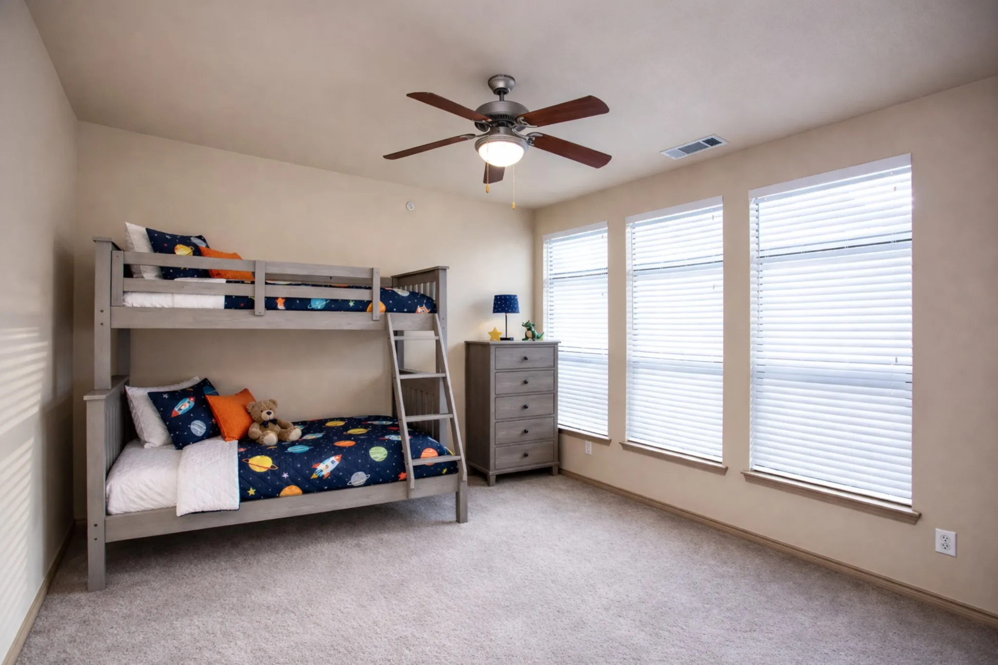 2nd Floor: Bedroom with light colored carpet and ceiling fan