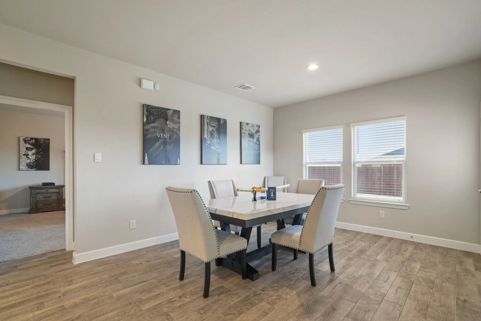 Dining space with light wood-type flooring and recessed lighting