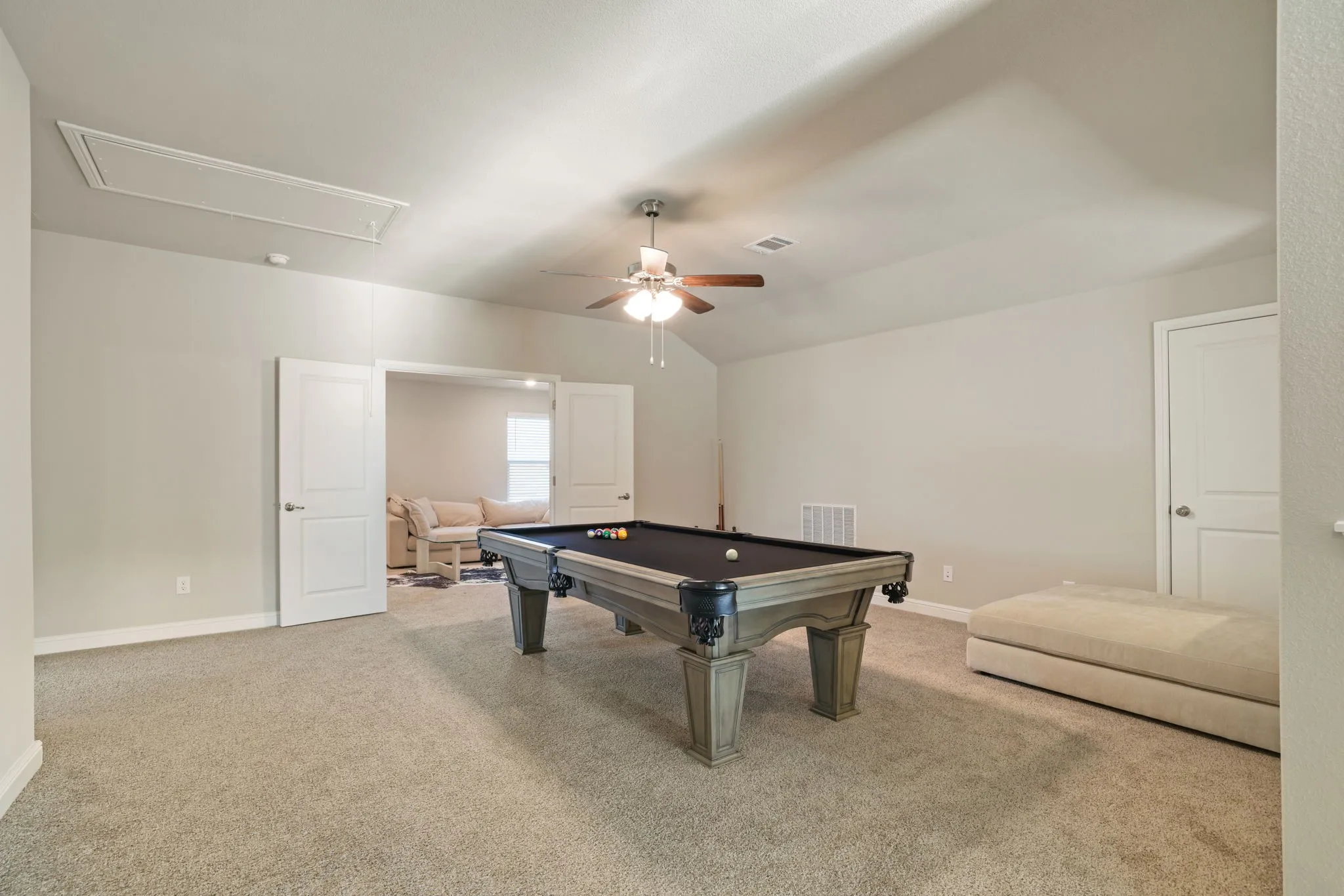 Playroom featuring pool table, carpet flooring, a ceiling fan, and lofted ceiling