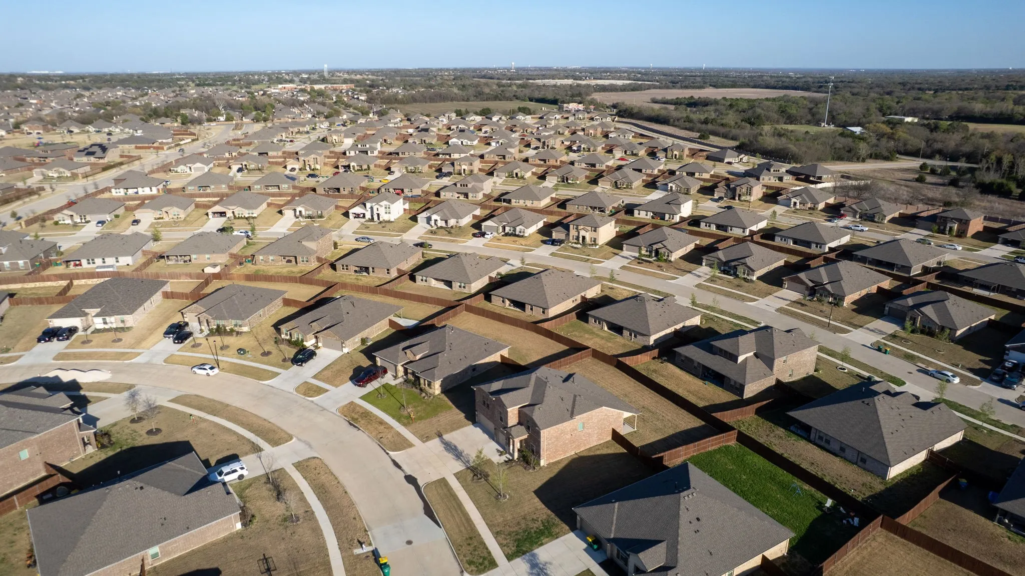 Aerial view of property's location with nearby suburban area