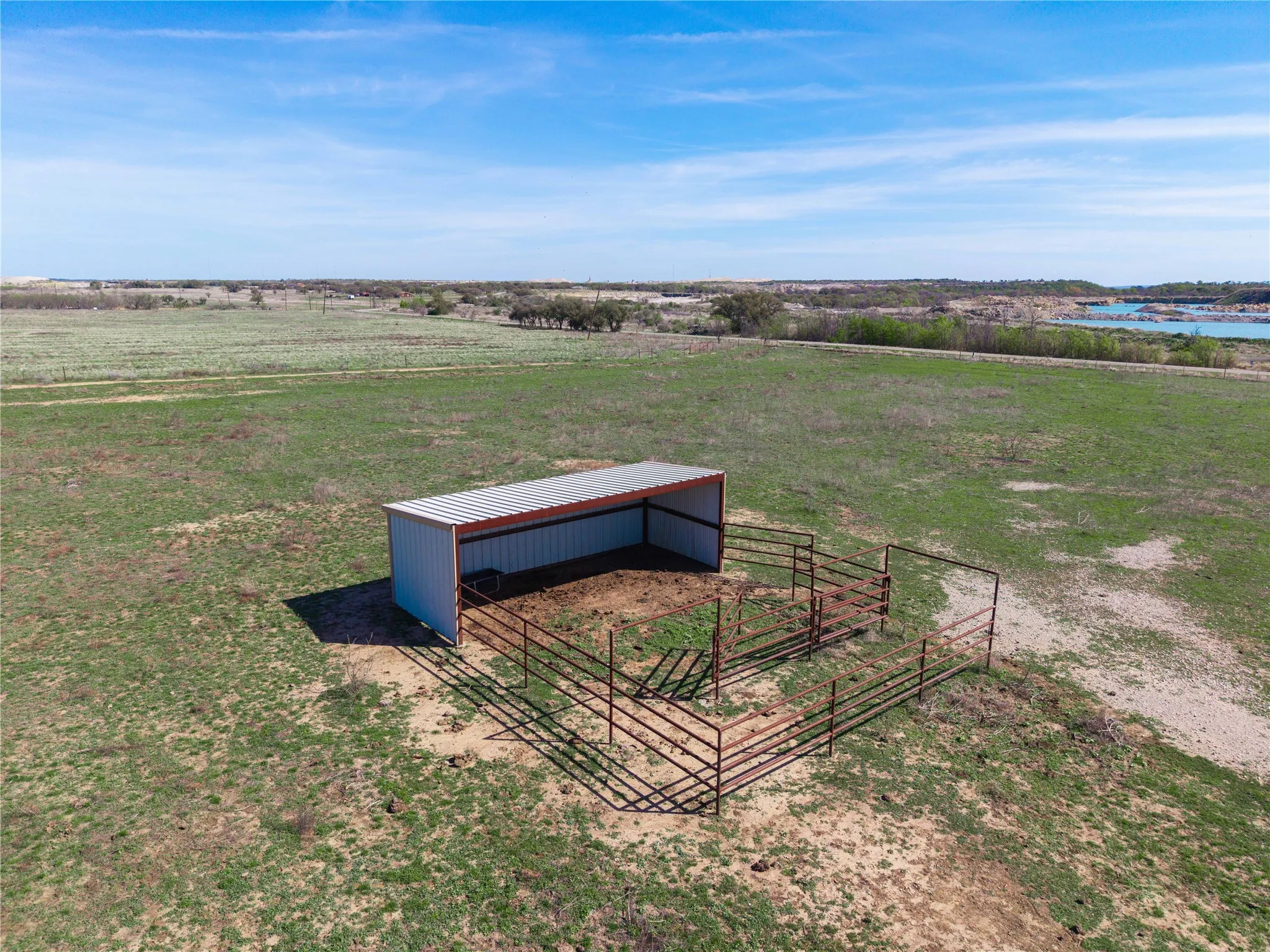 View of yard featuring an outbuilding, a view of countryside, and a pole building