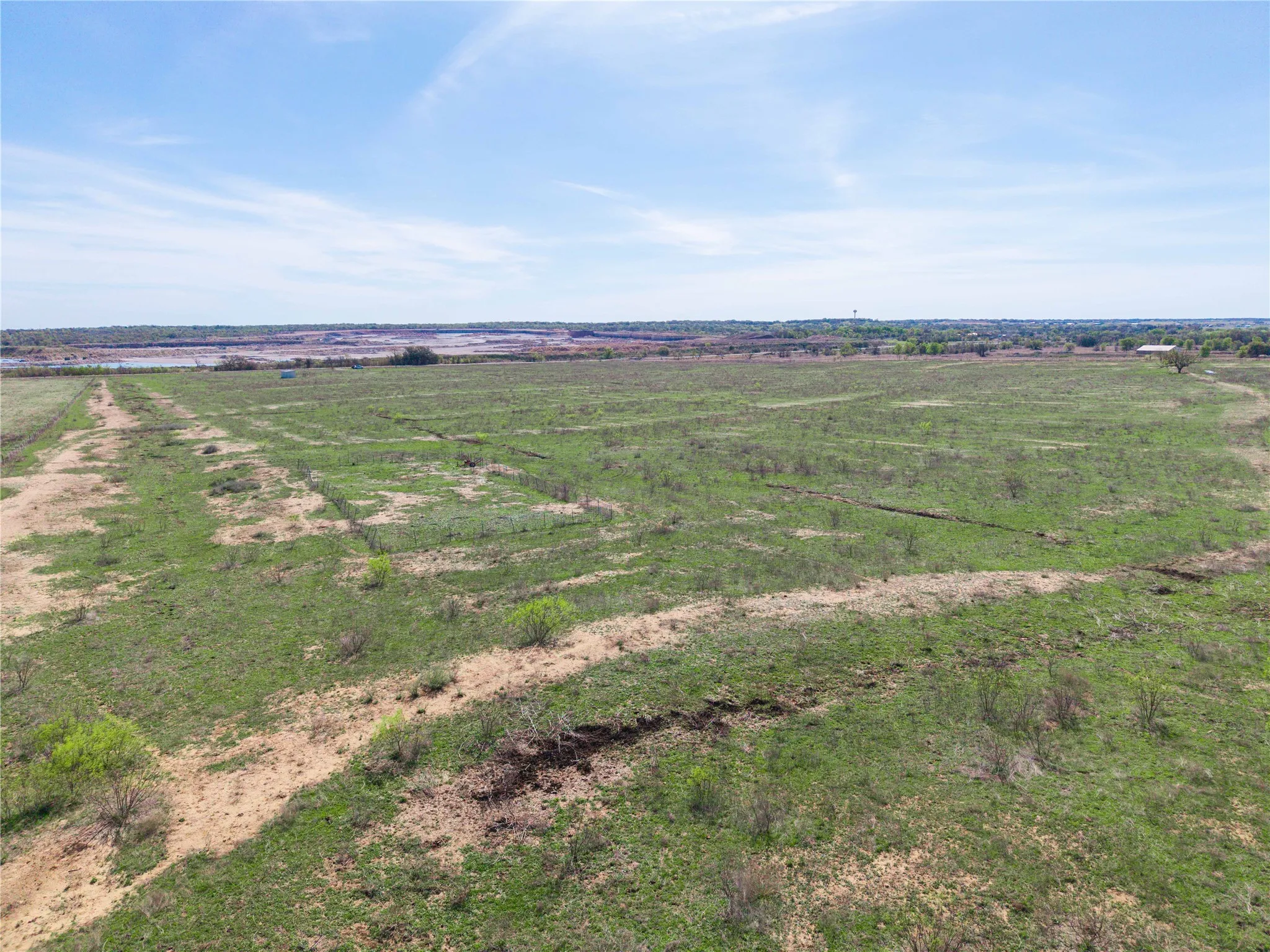Overview of rural landscape featuring rows of crops