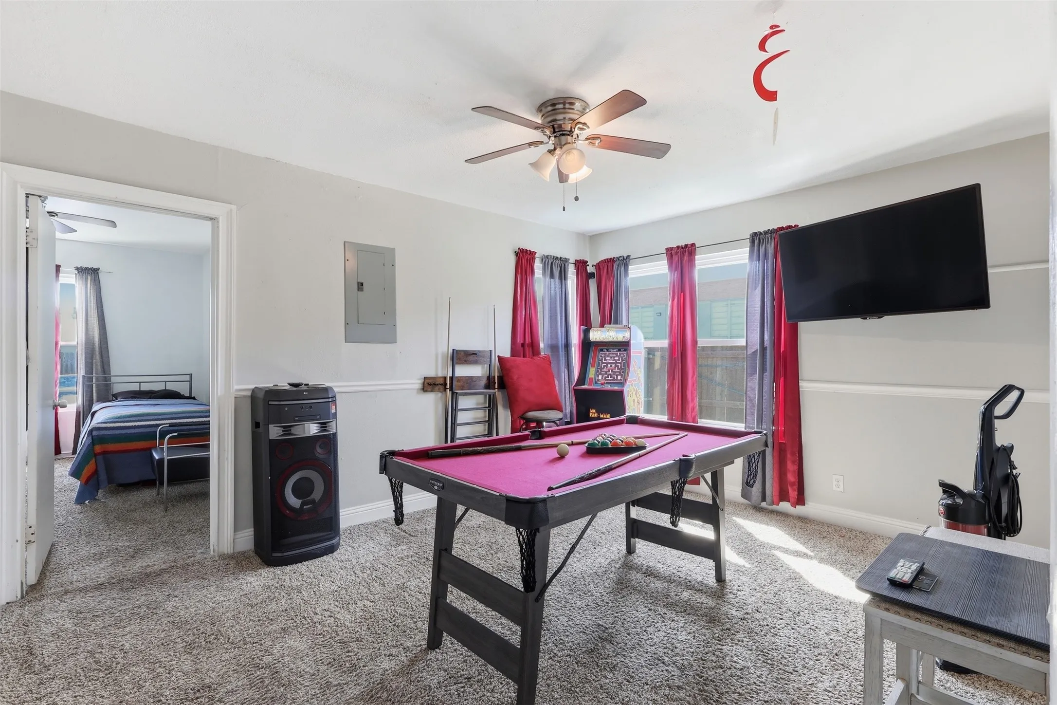 Bedroom 4 being used as a game room with full size closet. 5th bedroom accessed through this room