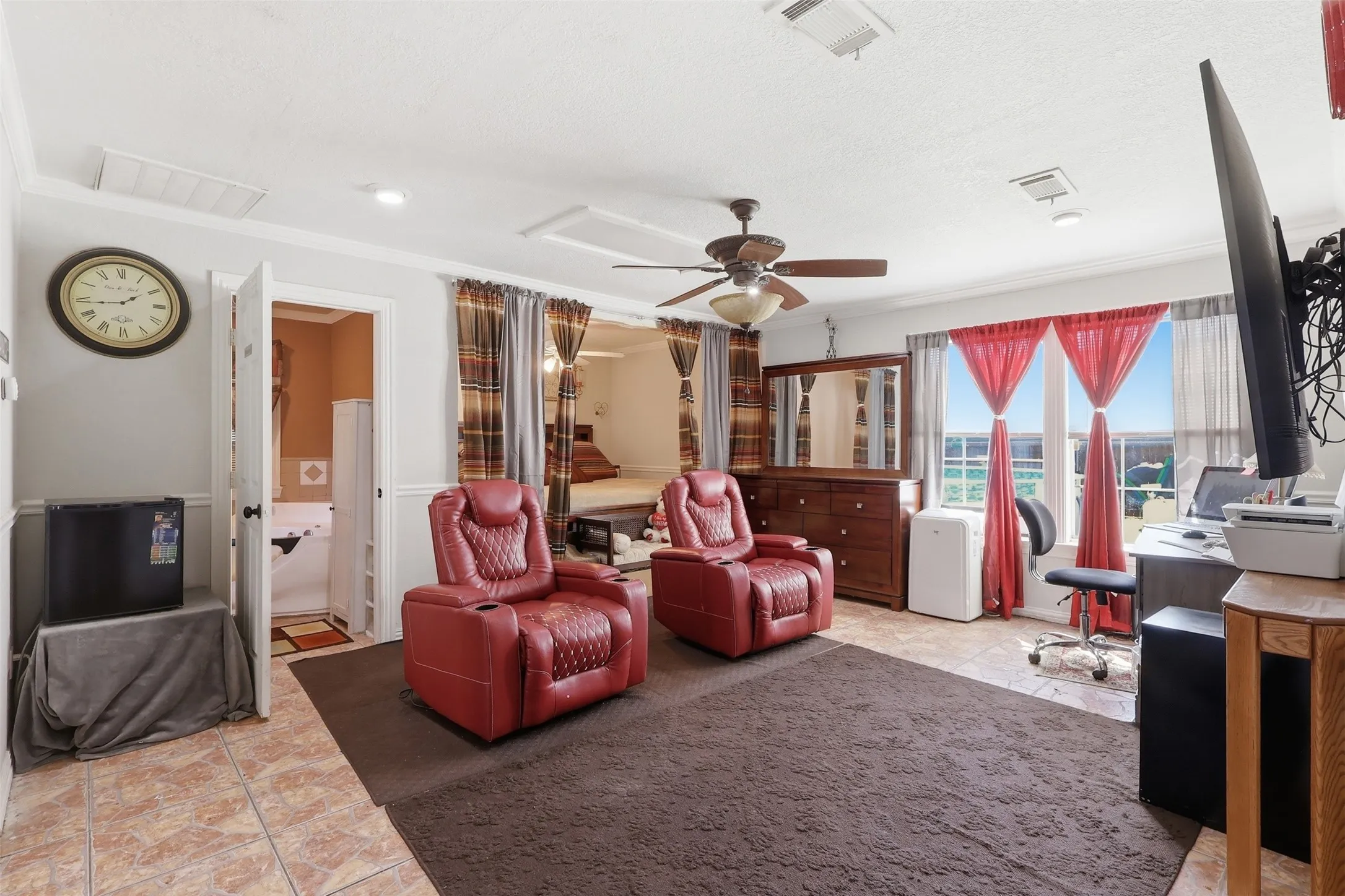 One of two primary bedrooms in rear of the home