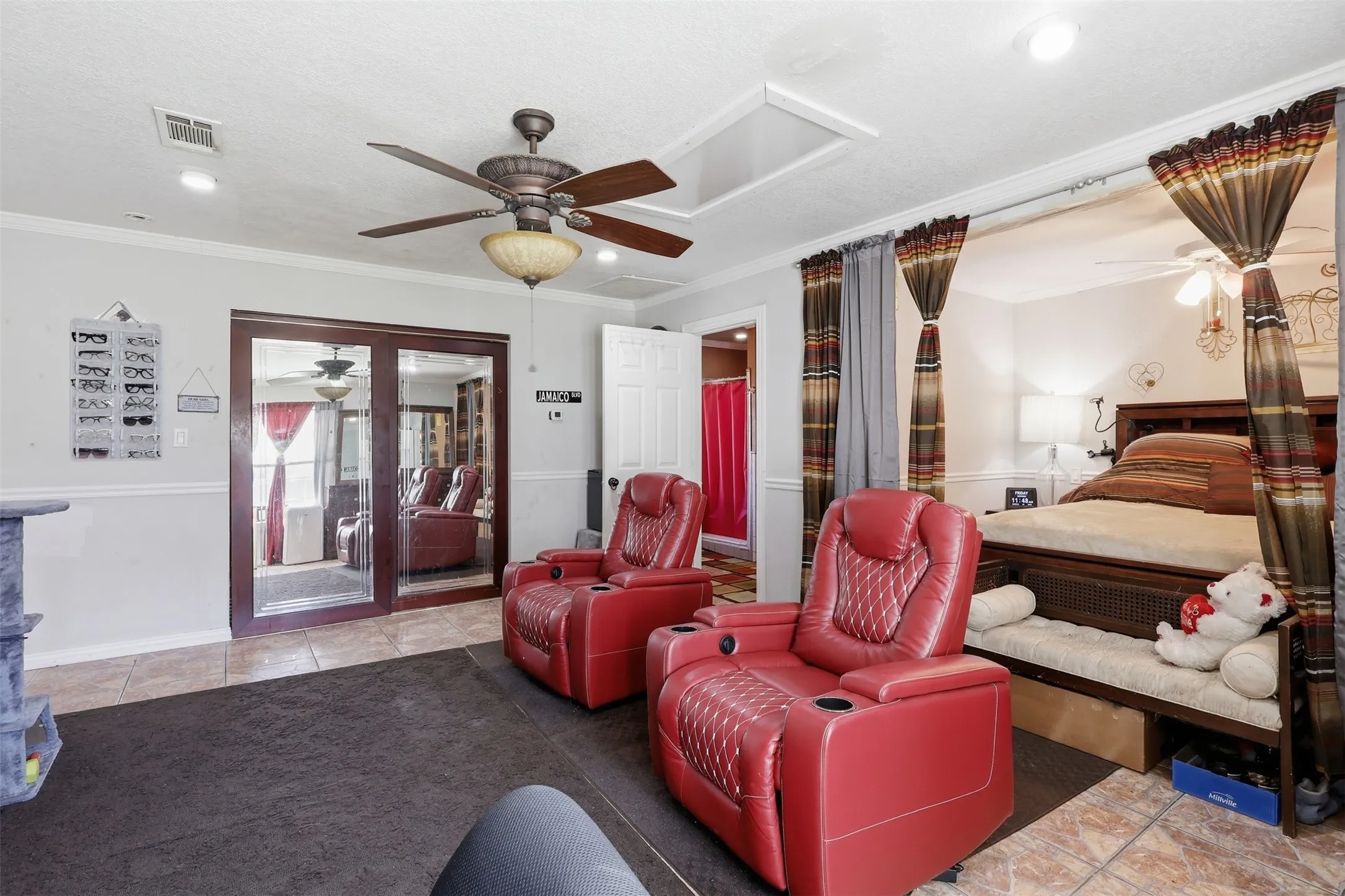 One of two primary bedrooms with sitting area