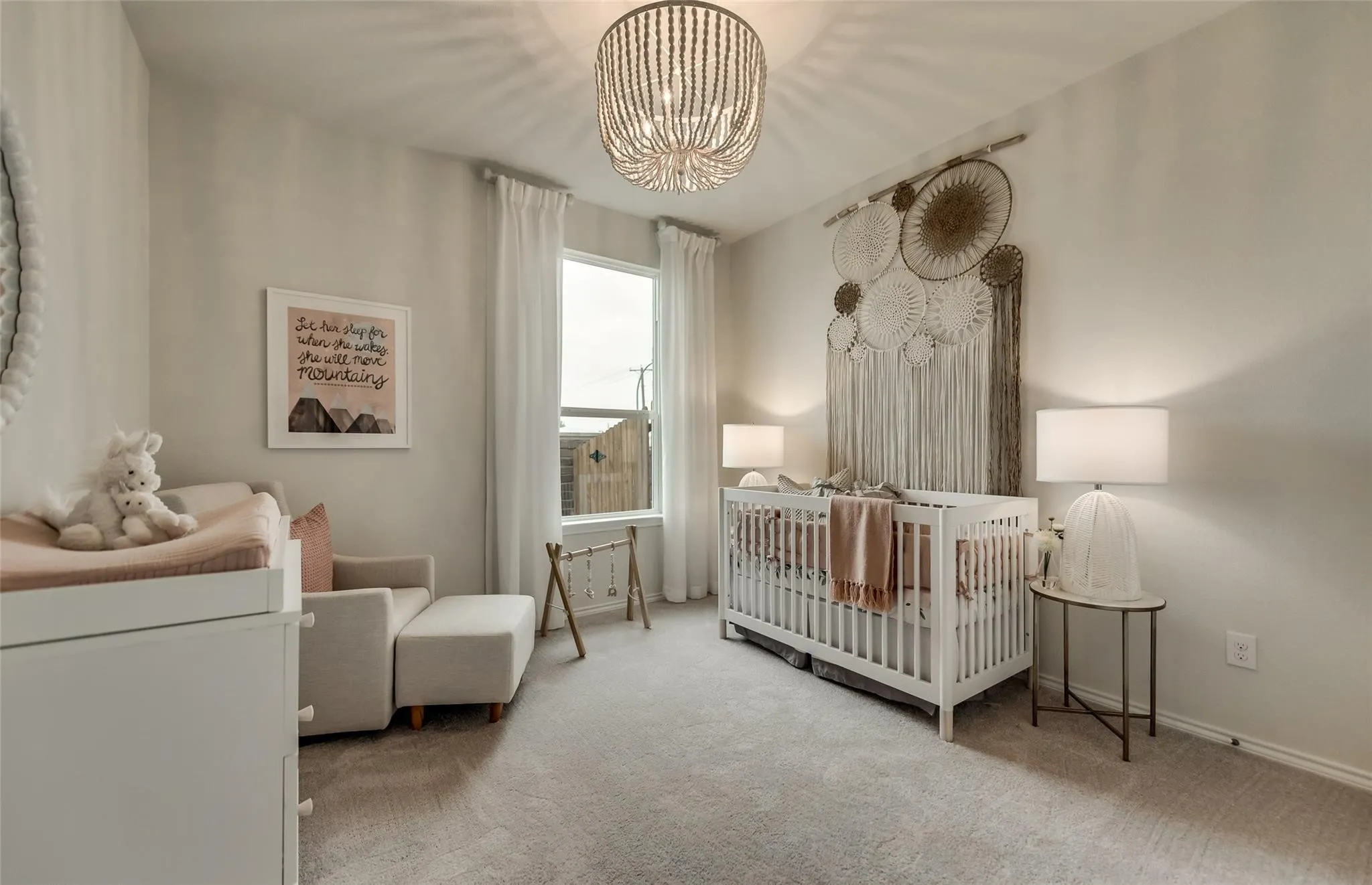 Soft neutral wall tones complement the light gray carpeting