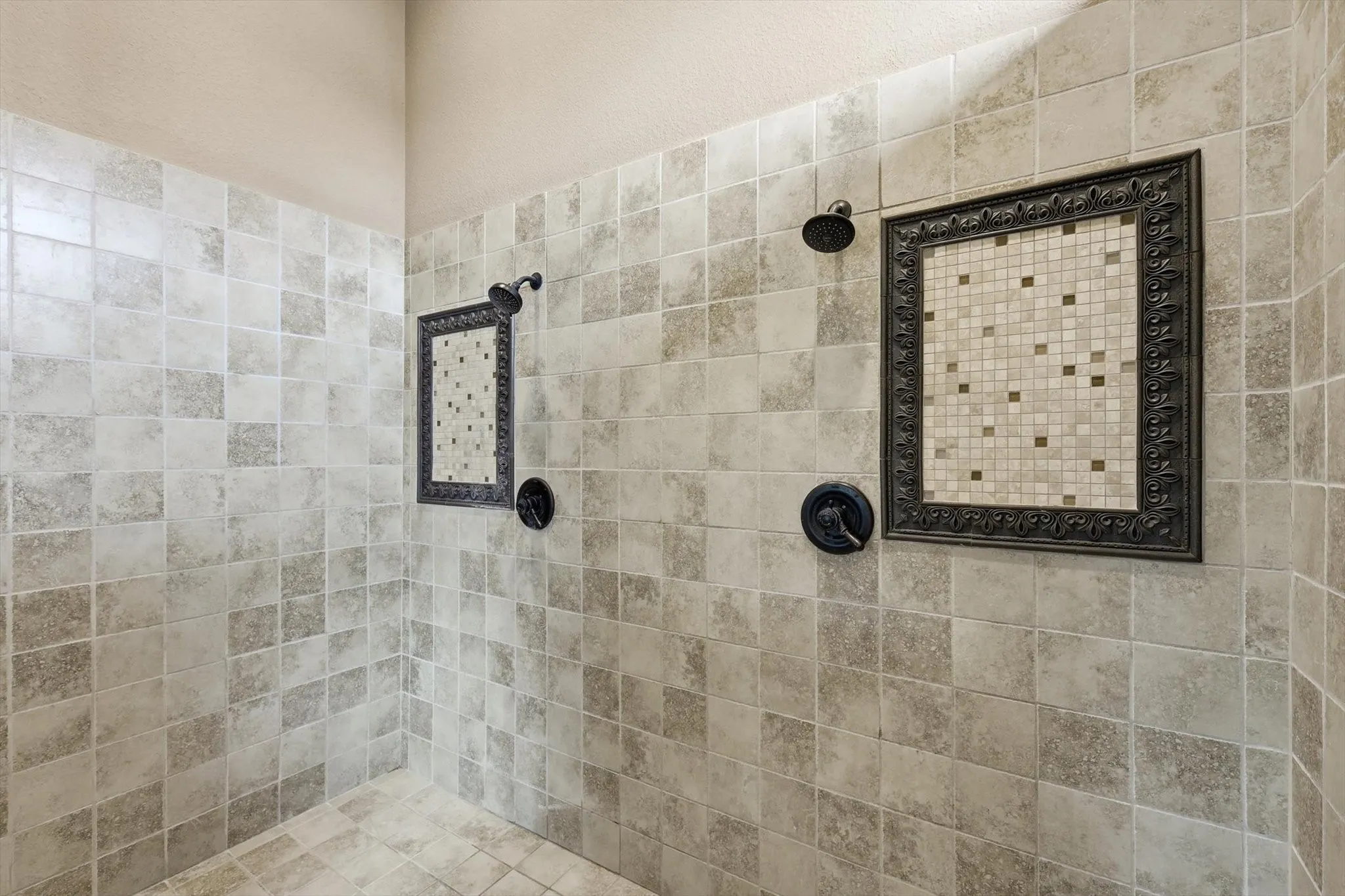 Full bath featuring a tile shower