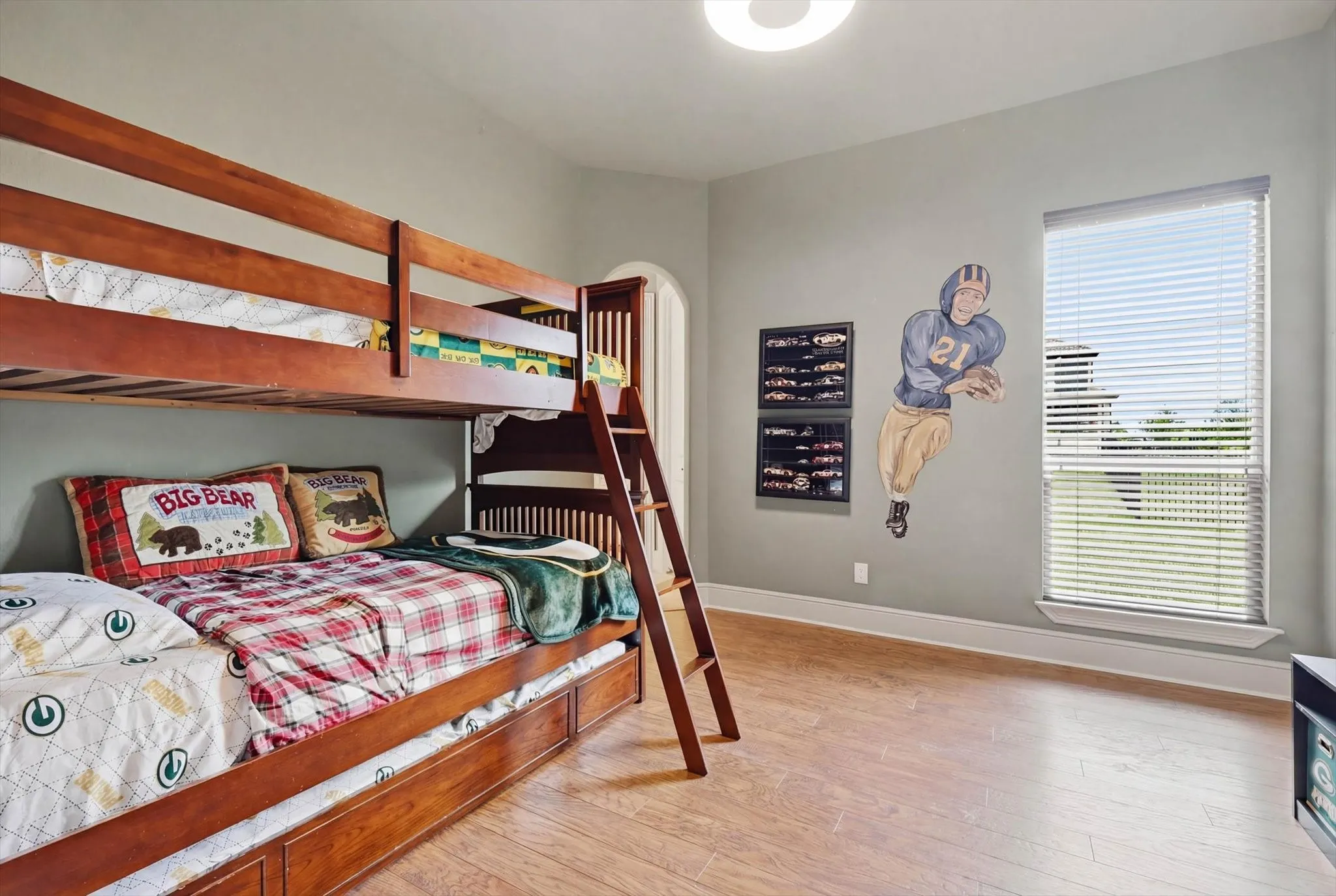 Bedroom featuring light wood-style floors and baseboards
