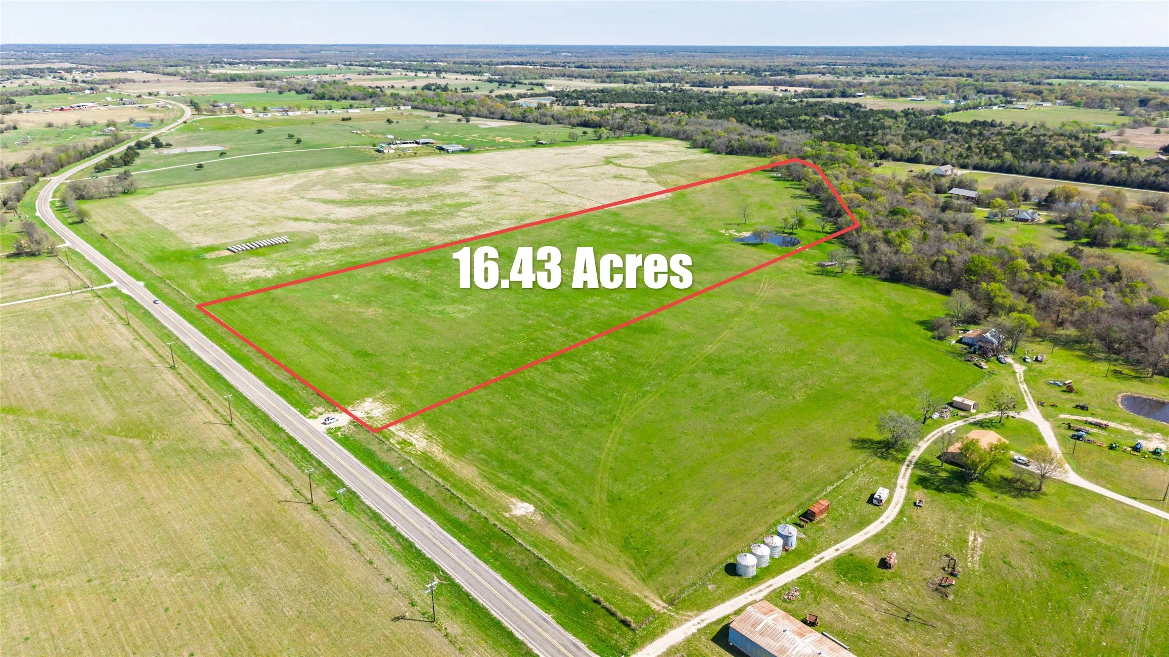 Aerial view of sparsely populated area with property boundaries highlighted