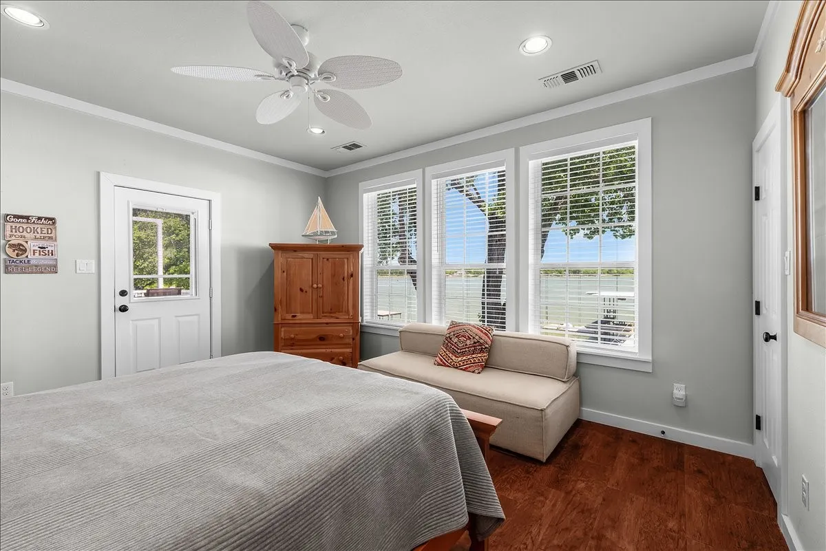 Bedroom with crown molding, dark wood-type flooring, ceiling fan, and recessed lighting