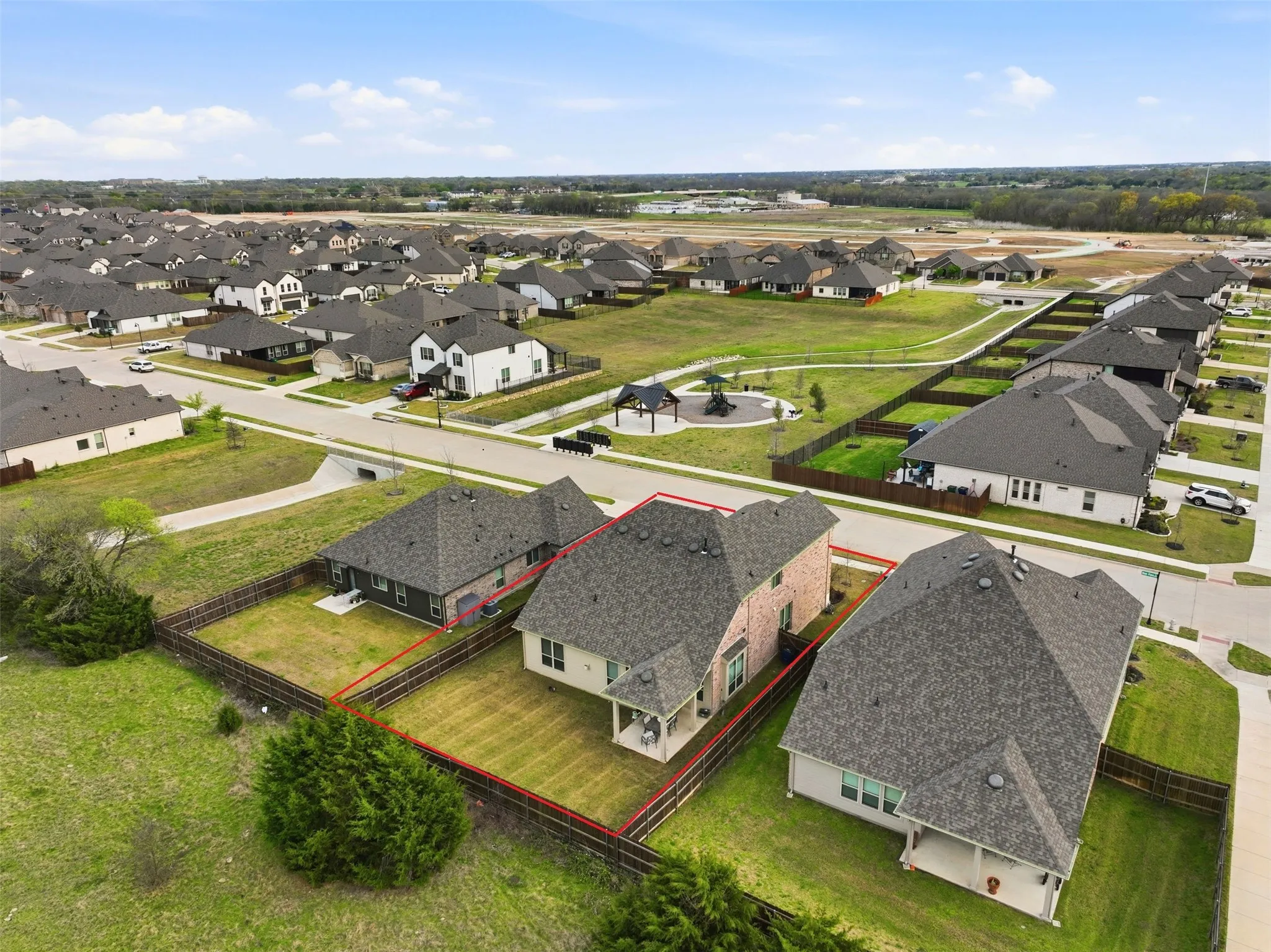Aerial perspective of suburban area with property parcel outlined