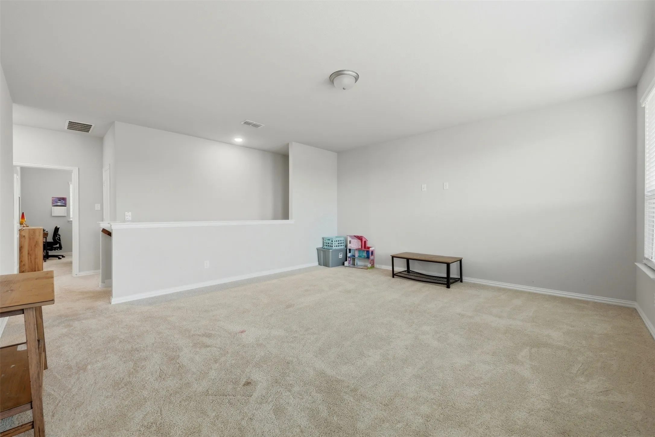 Unfurnished room with light carpet and recessed lighting