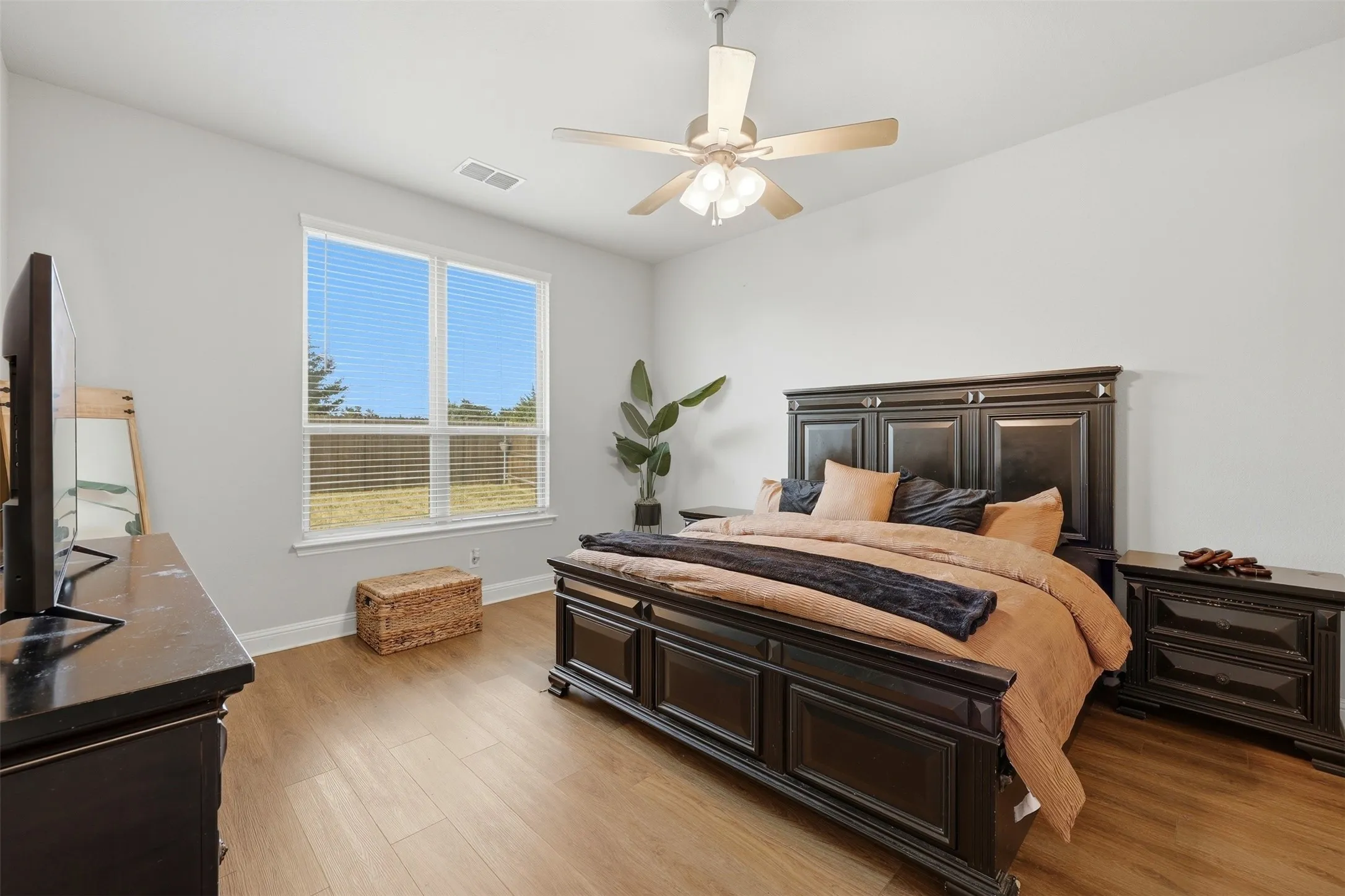 Bedroom with light wood-type flooring and ceiling fan