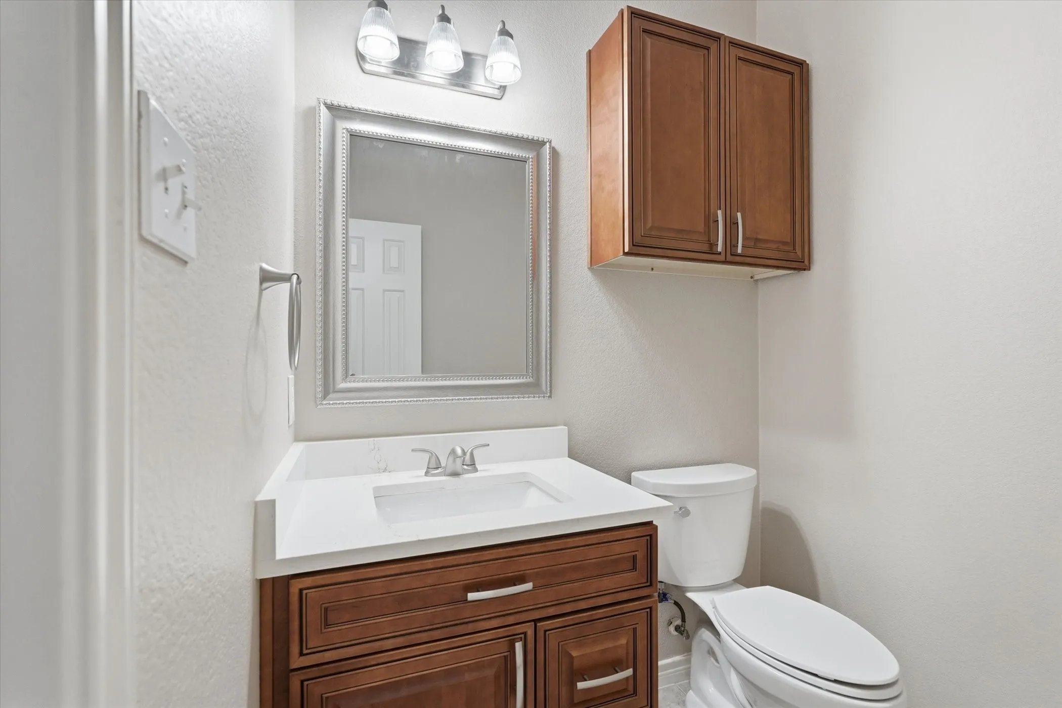 Half bath with vanity and toilet