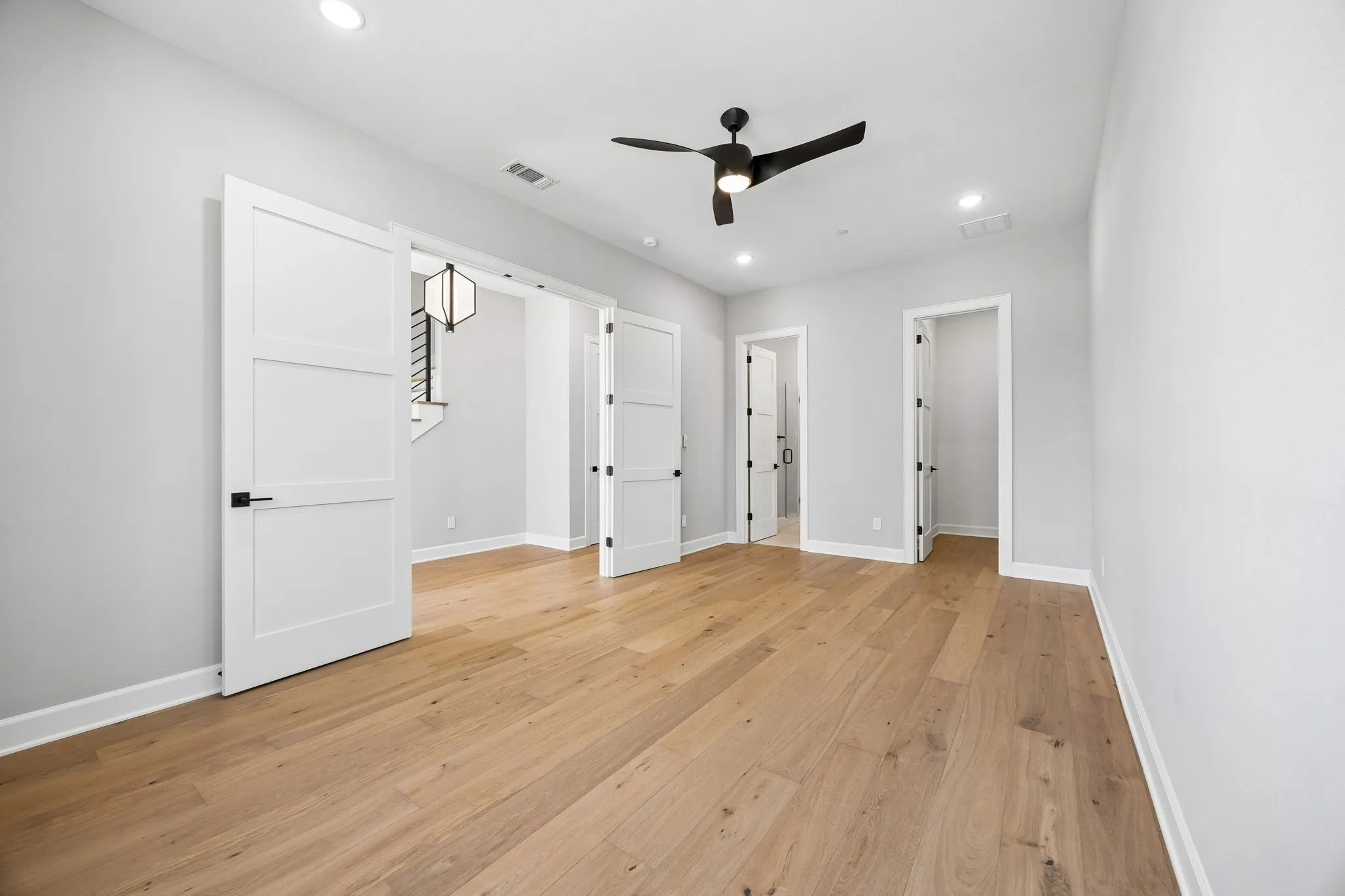 Unfurnished bedroom featuring light wood-style flooring, recessed lighting, and ceiling fan