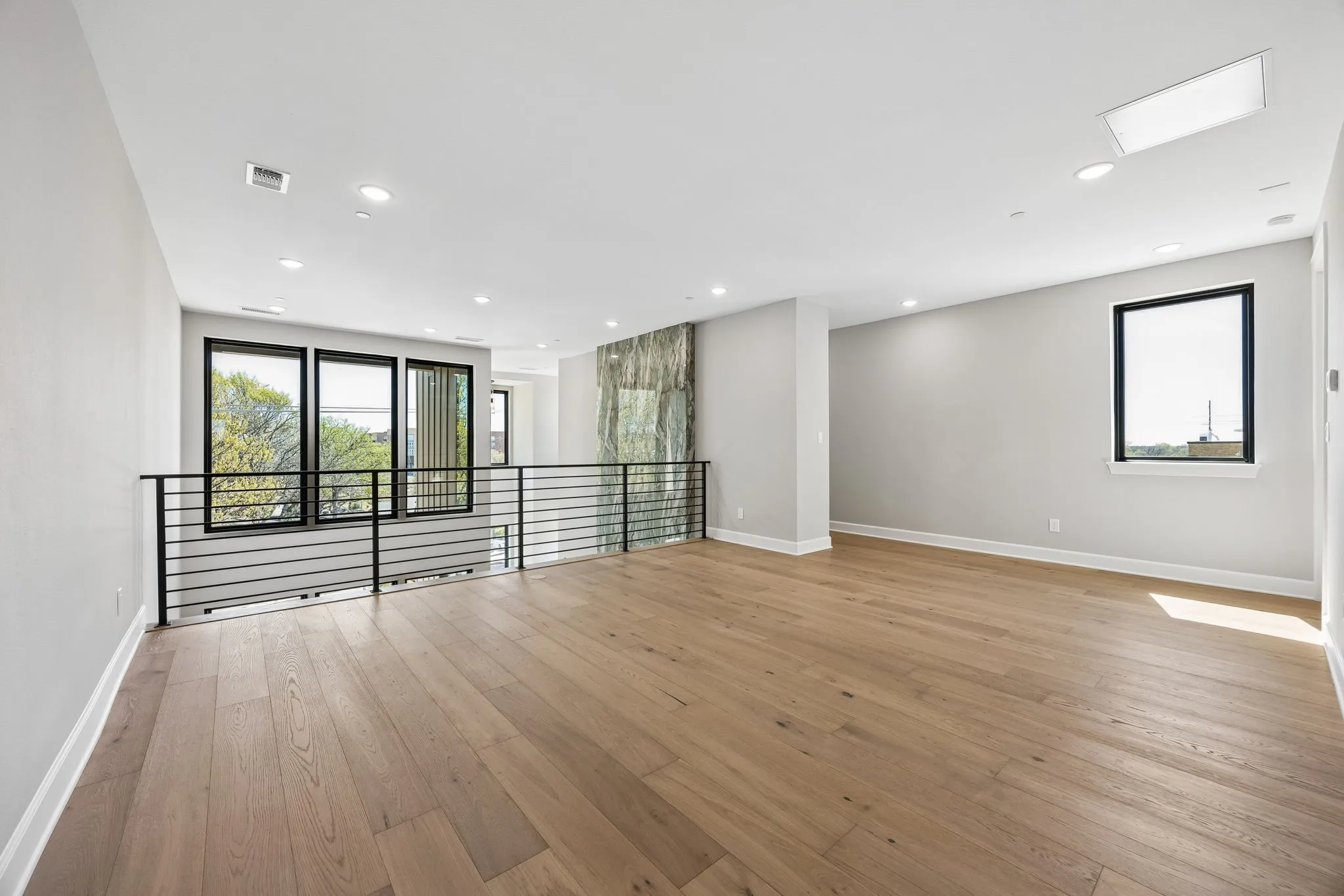 Spare room featuring light wood finished floors and recessed lighting