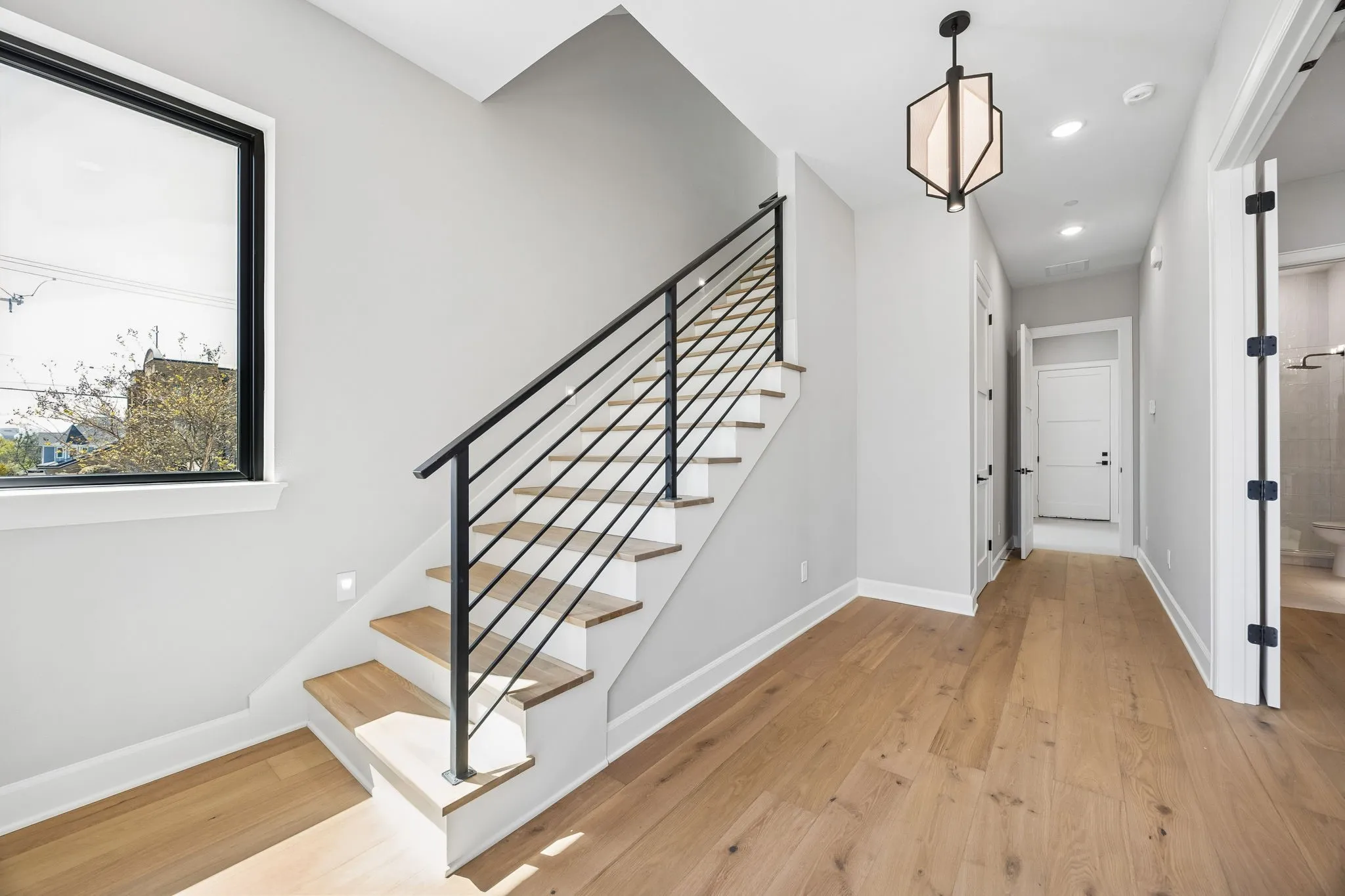 Foyer featuring light wood-style flooring and recessed lighting