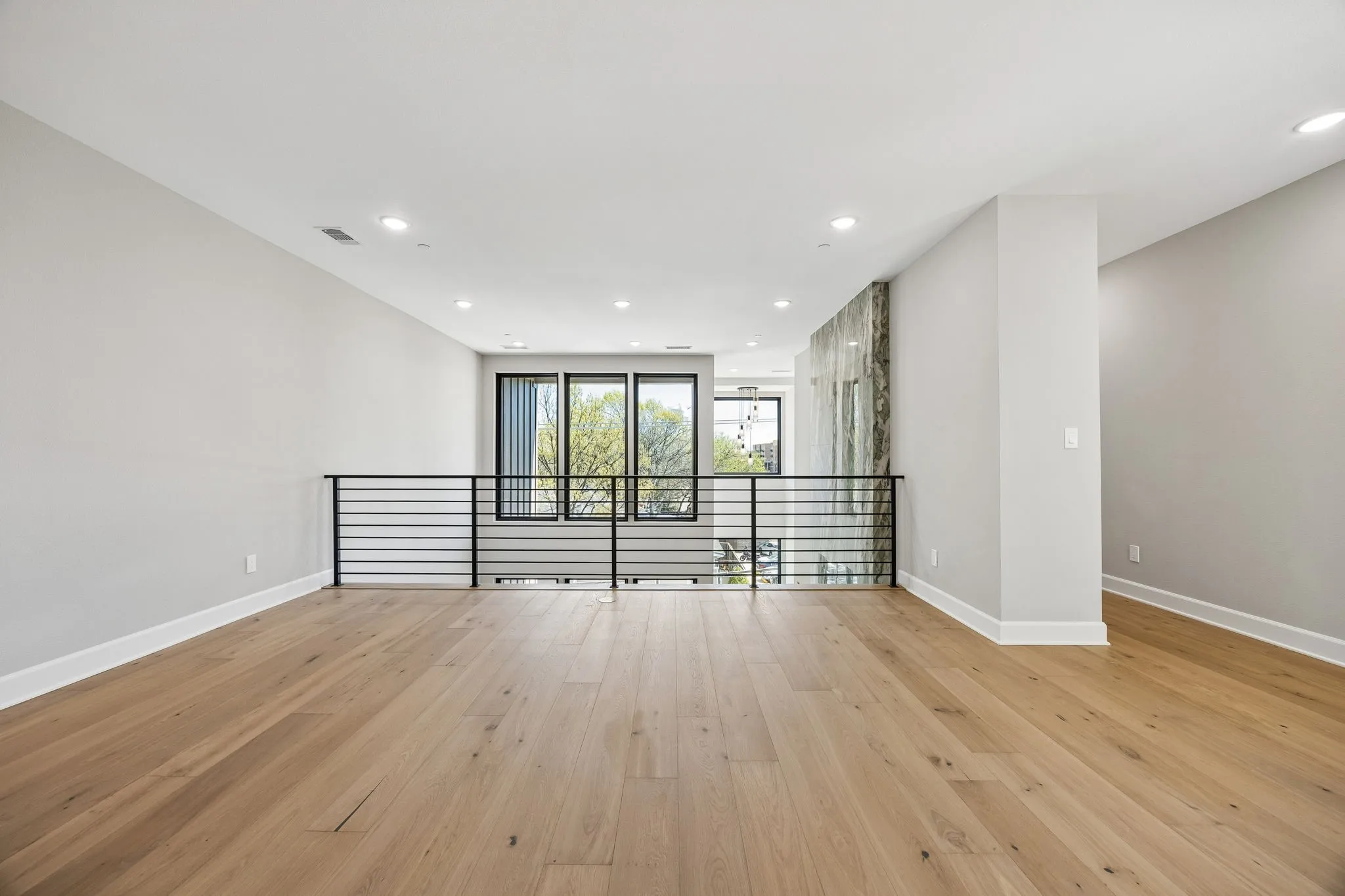 Unfurnished room featuring light wood-style floors and recessed lighting