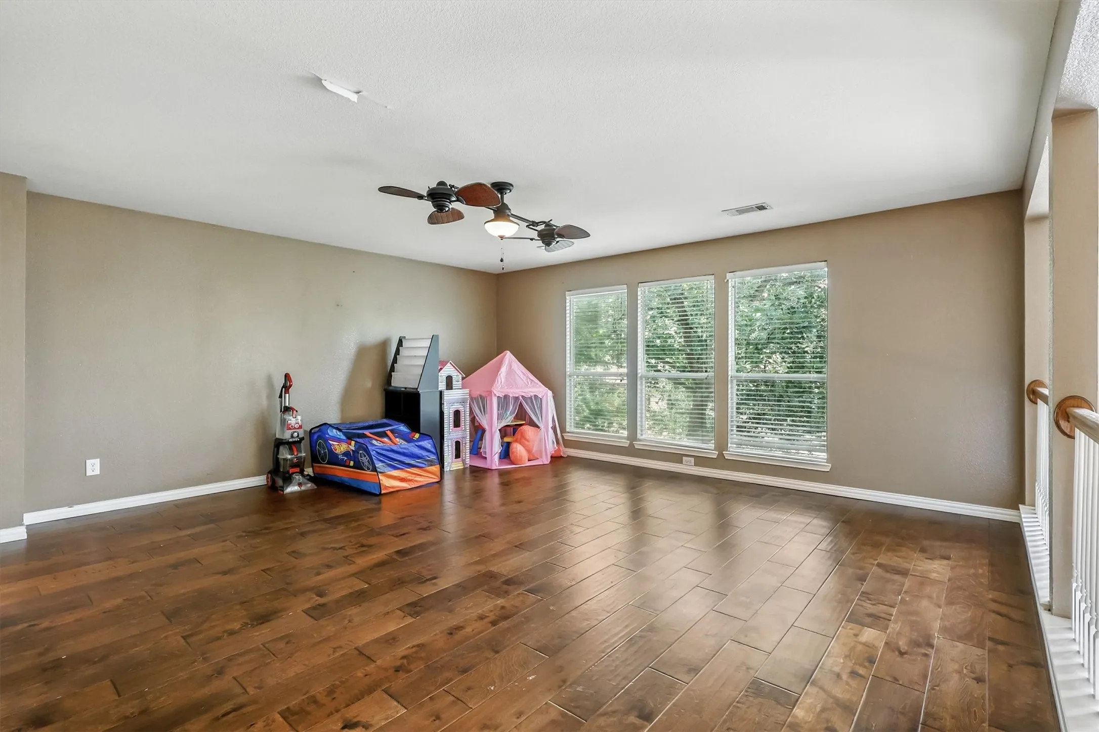 Game room featuring wood finished floors and a ceiling fan