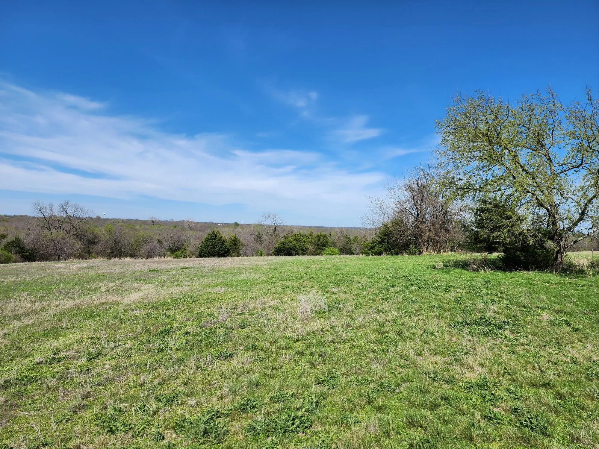View of green lawn featuring a view of countryside
