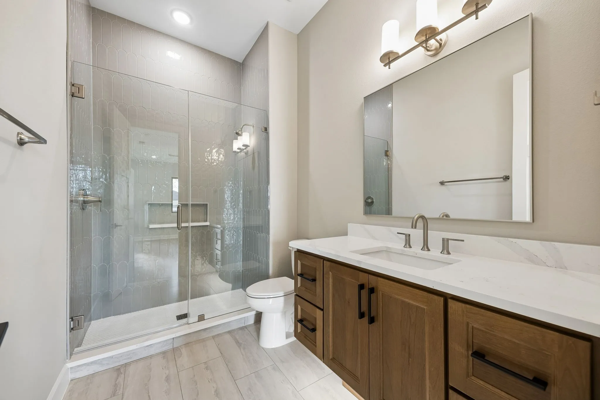 Bathroom featuring vanity and a shower stall