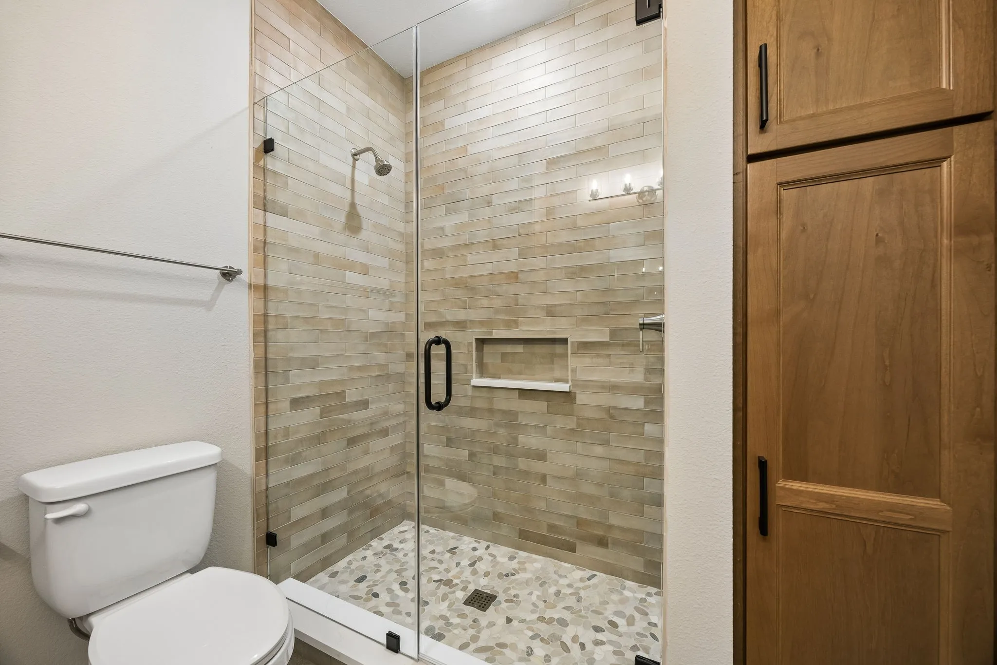 Bathroom with toilet and a shower stall