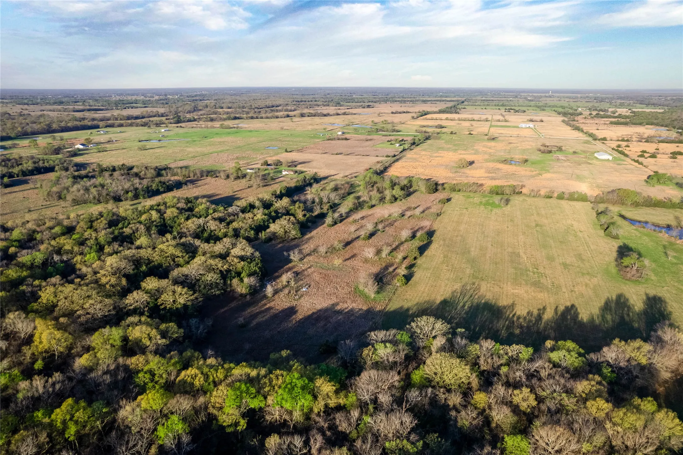 Aerial view of sparsely populated area featuring extensive farmland