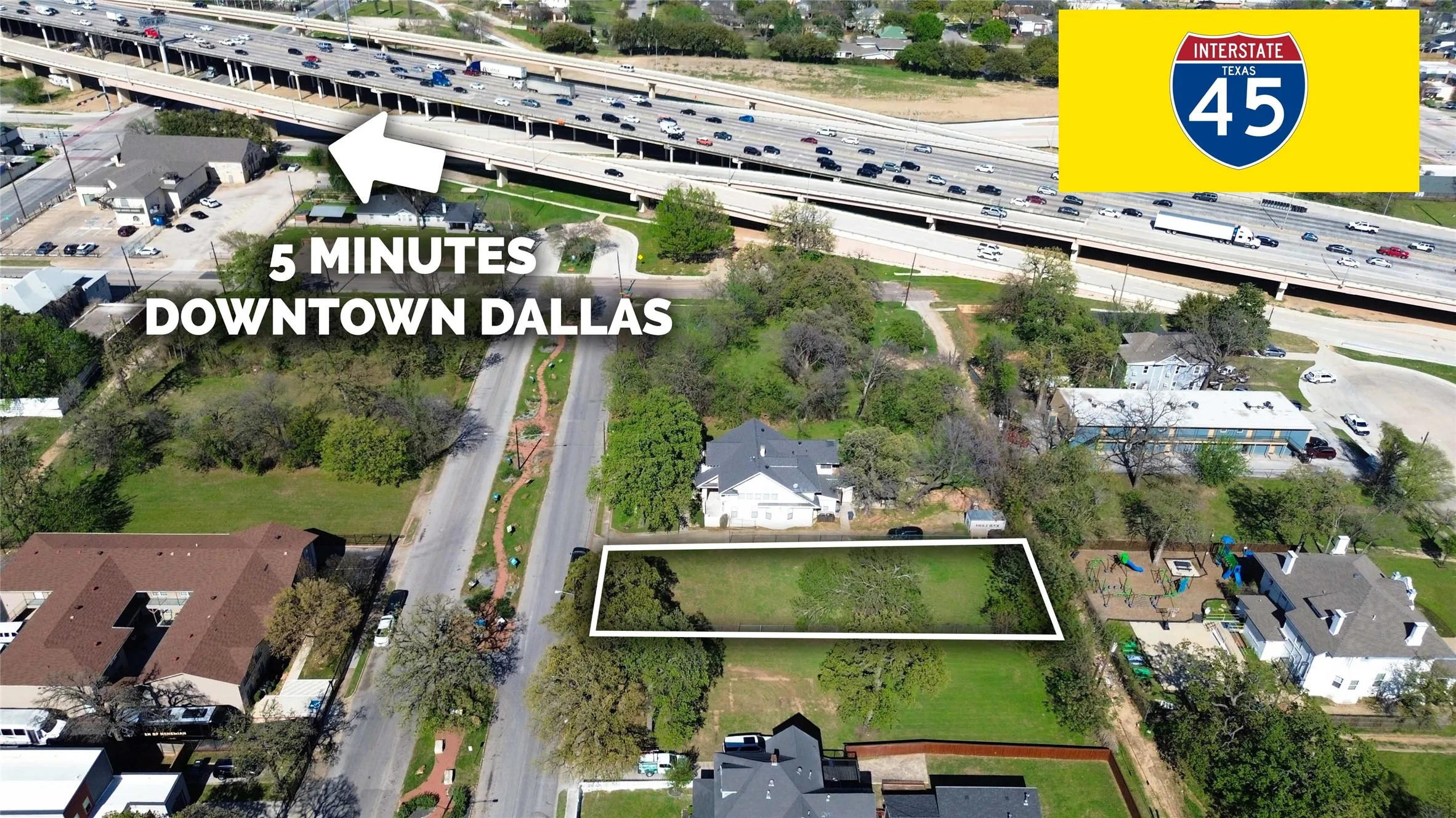 Aerial perspective of suburban area with a main thoroughfare and property boundaries highlighted