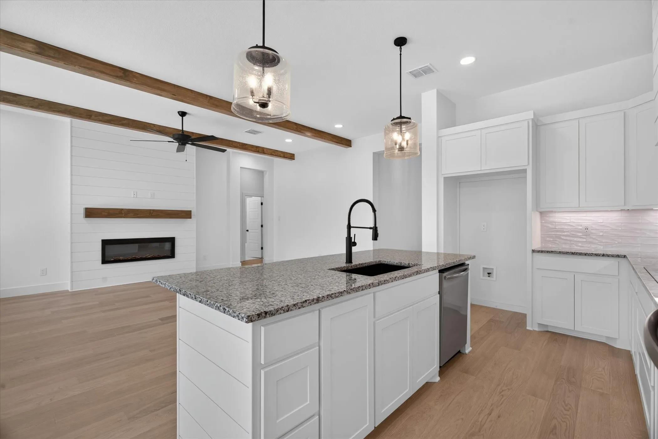 Kitchen island with granite countertop and undermount sink