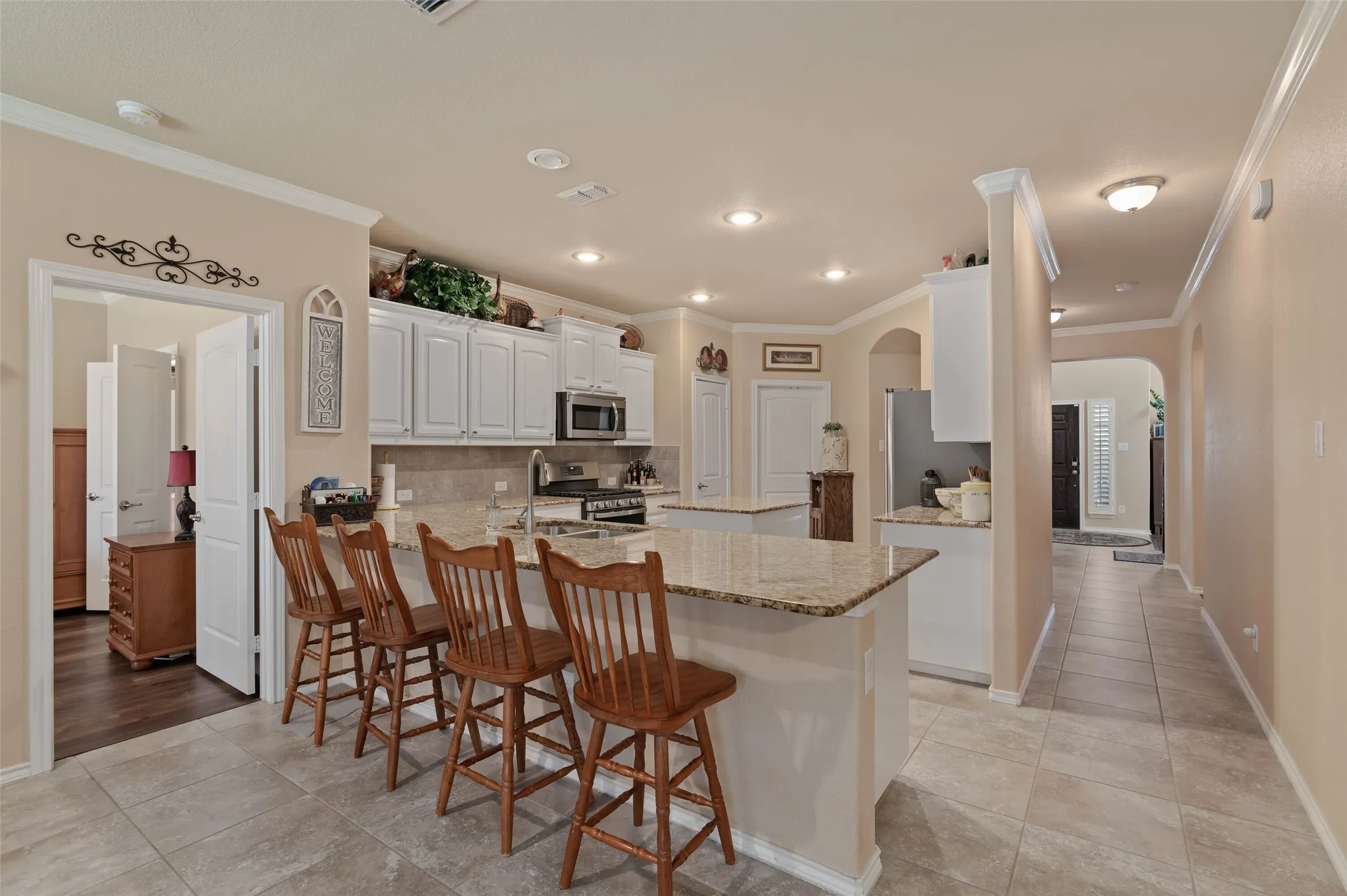 Kitchen with breakfast bar and dining space