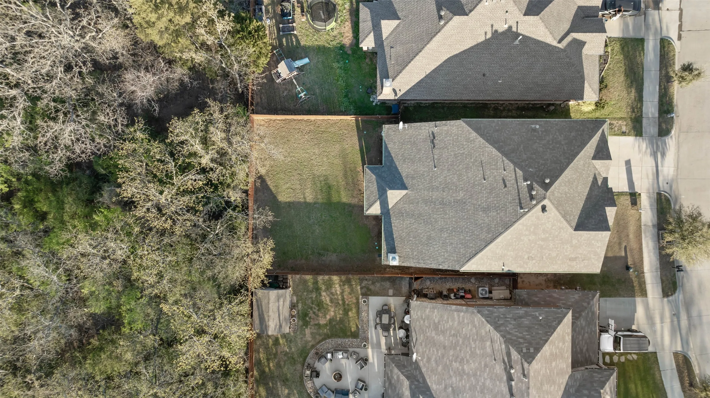 Enjoy all the greenery with back porch views of the treeline and a greenbelt one house over.