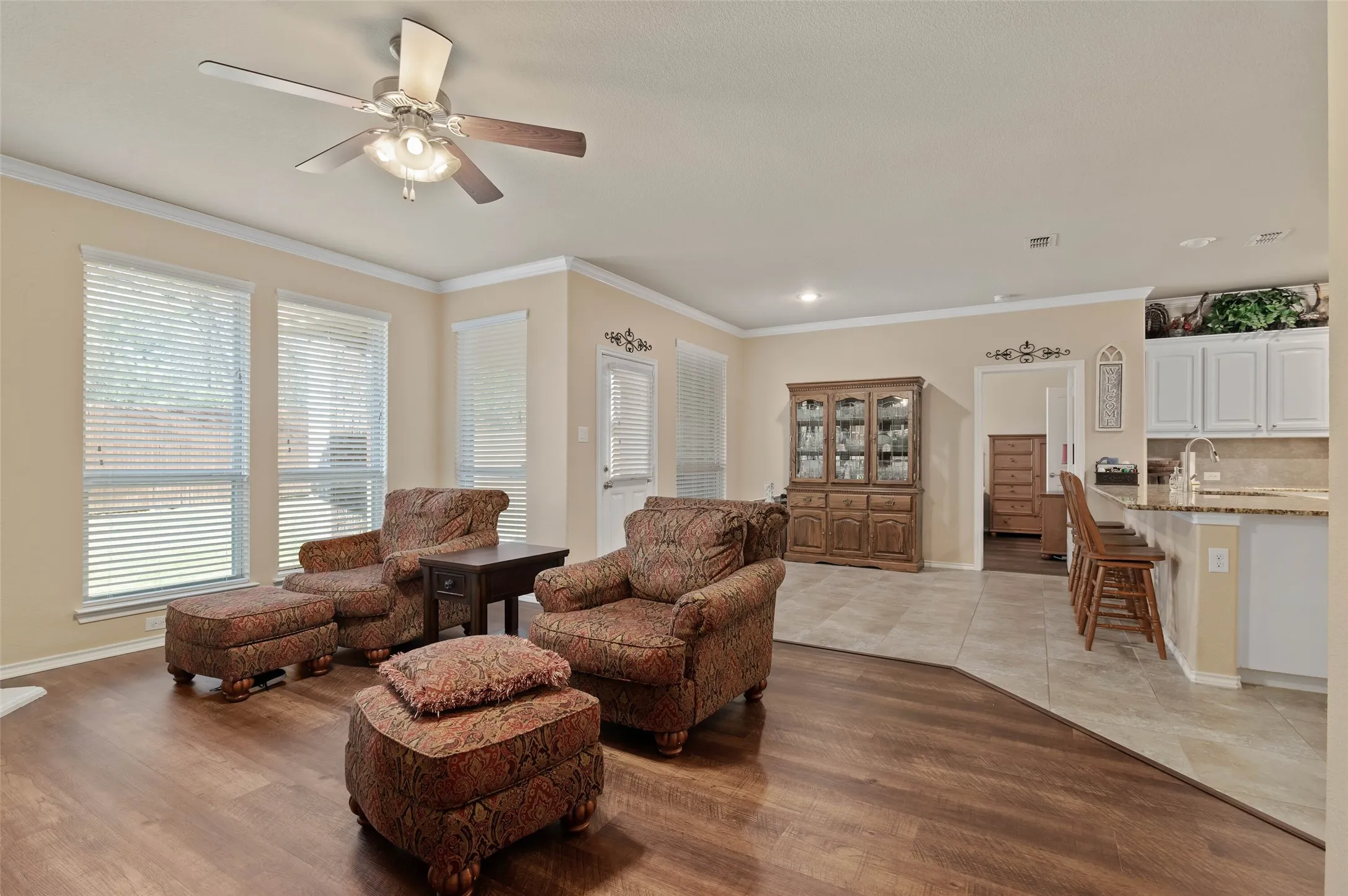 Main living area with fireplace off the kitchen and breakfast area