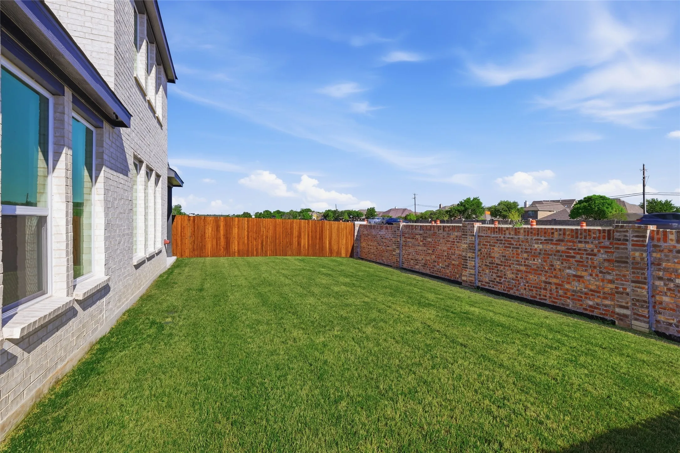View of fenced backyard