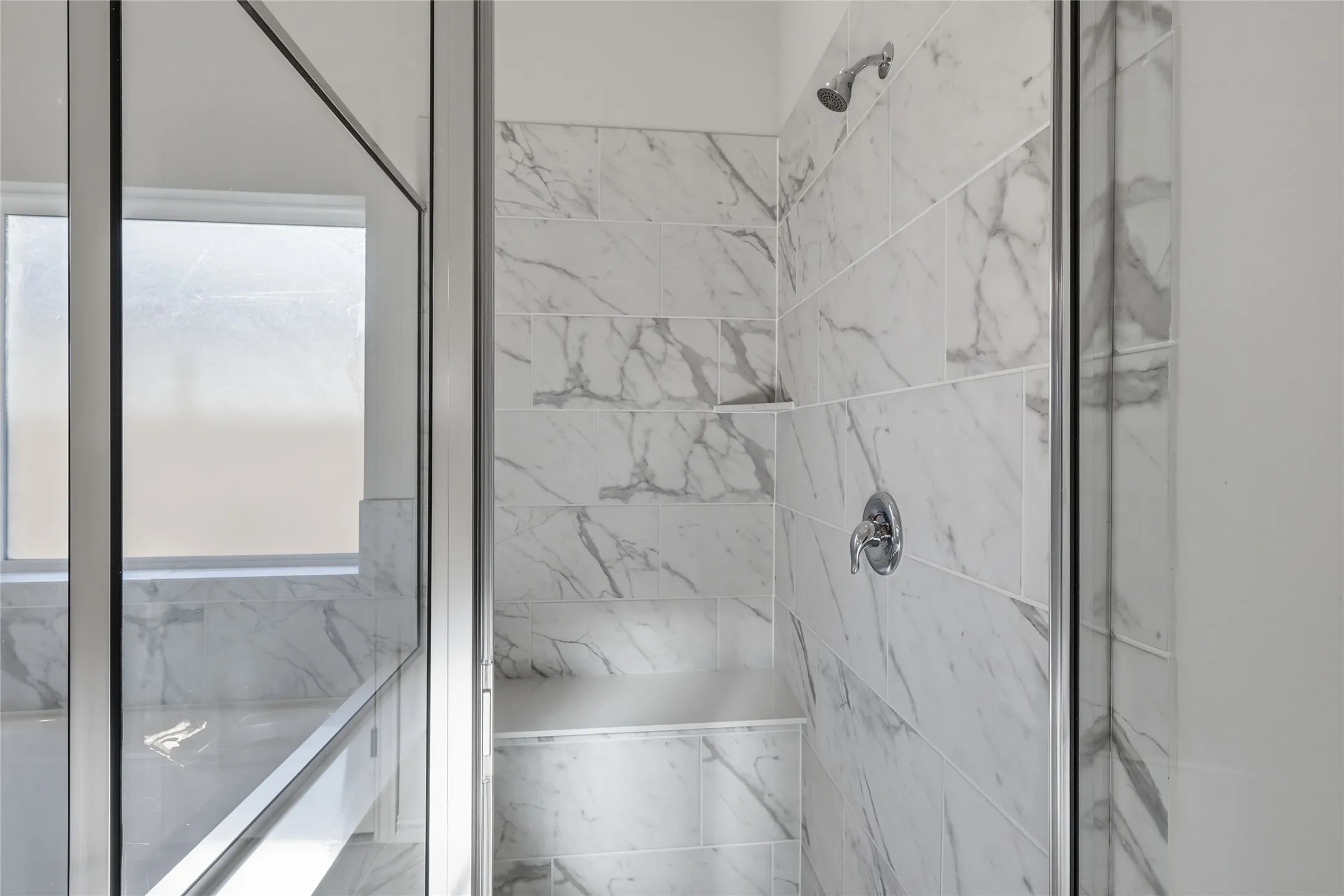 Bathroom featuring a marble finish shower and a tub with marble appearance