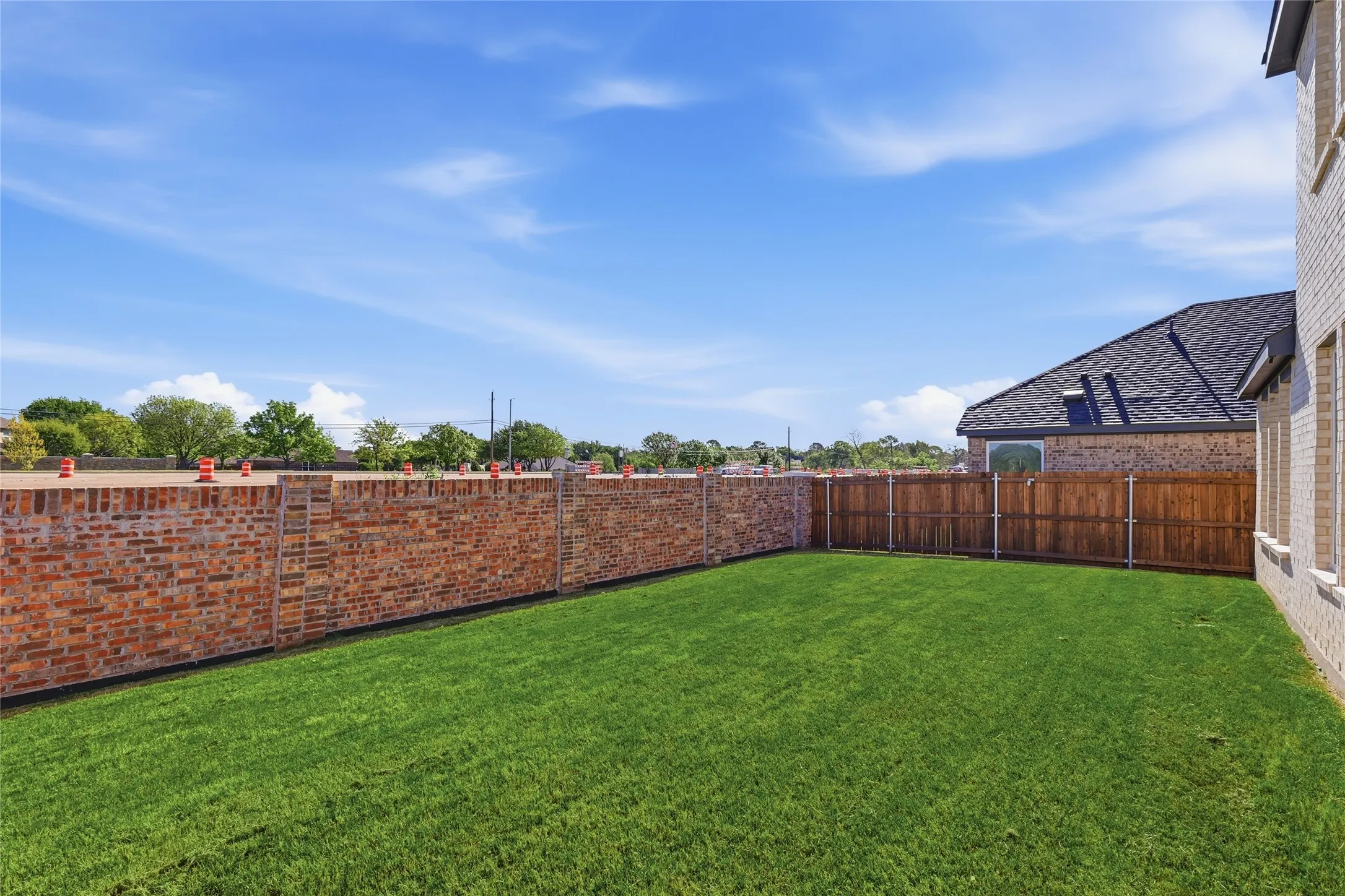 View of fenced backyard