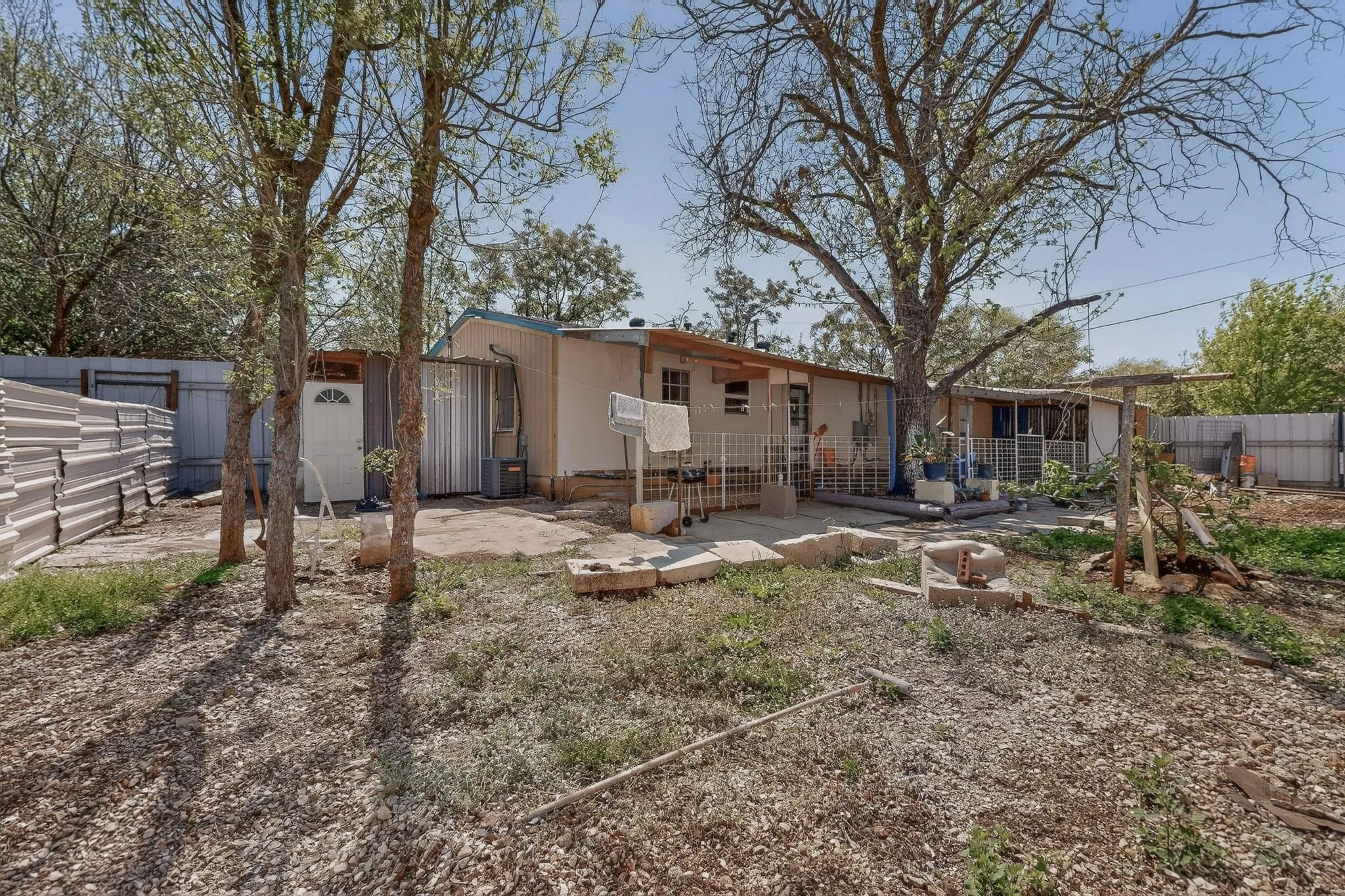 Back of house featuring a fenced backyard and a patio