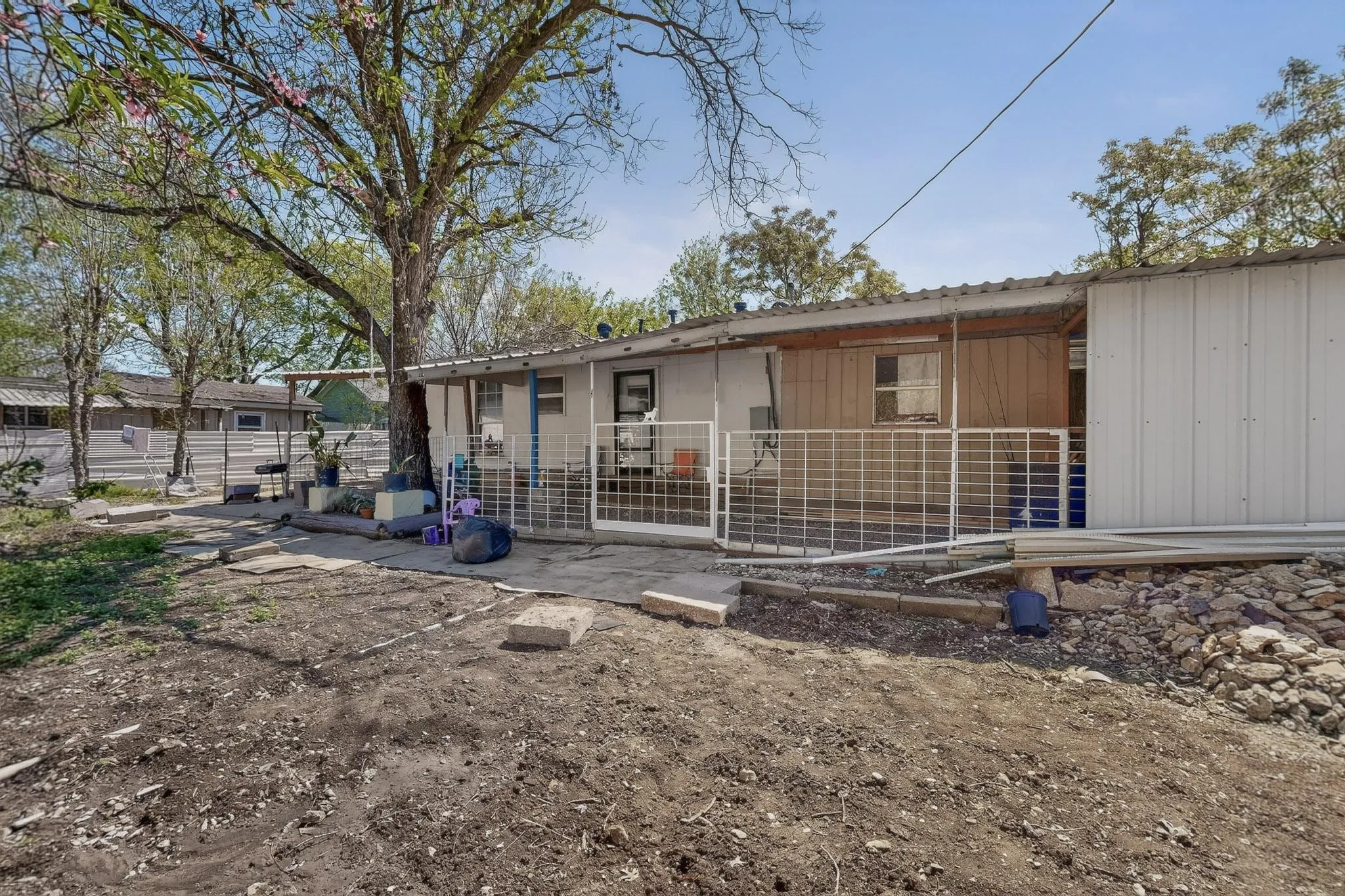 Back of property with a patio