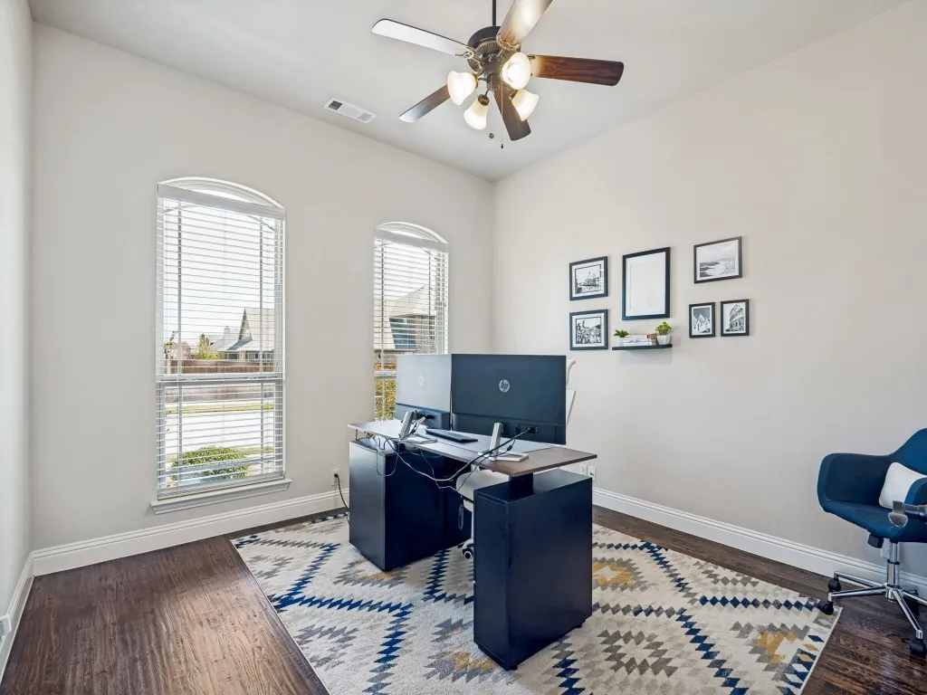 Office featuring dark wood finished floors and a ceiling fan
