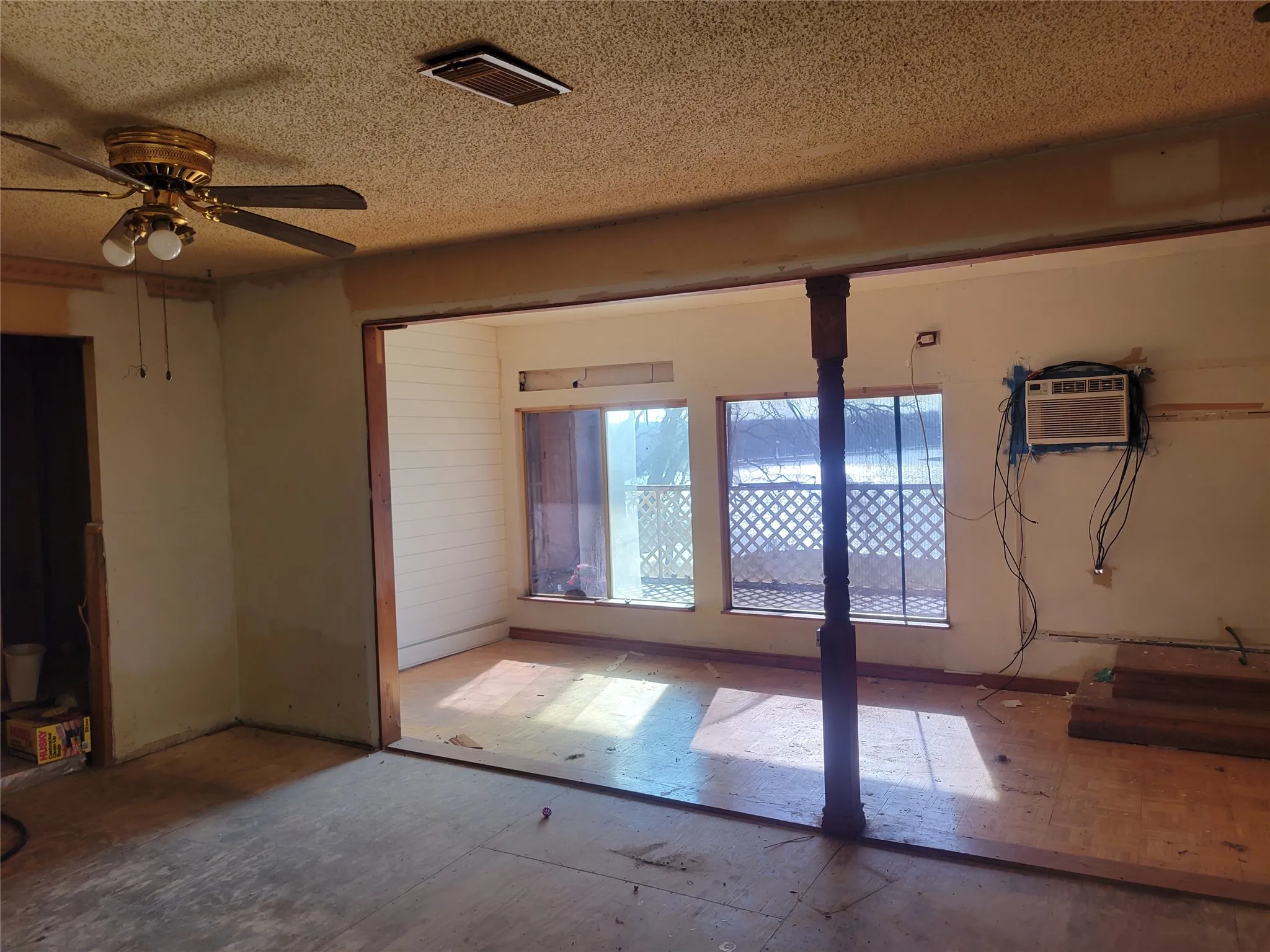 Spare room featuring a ceiling fan and a textured ceiling