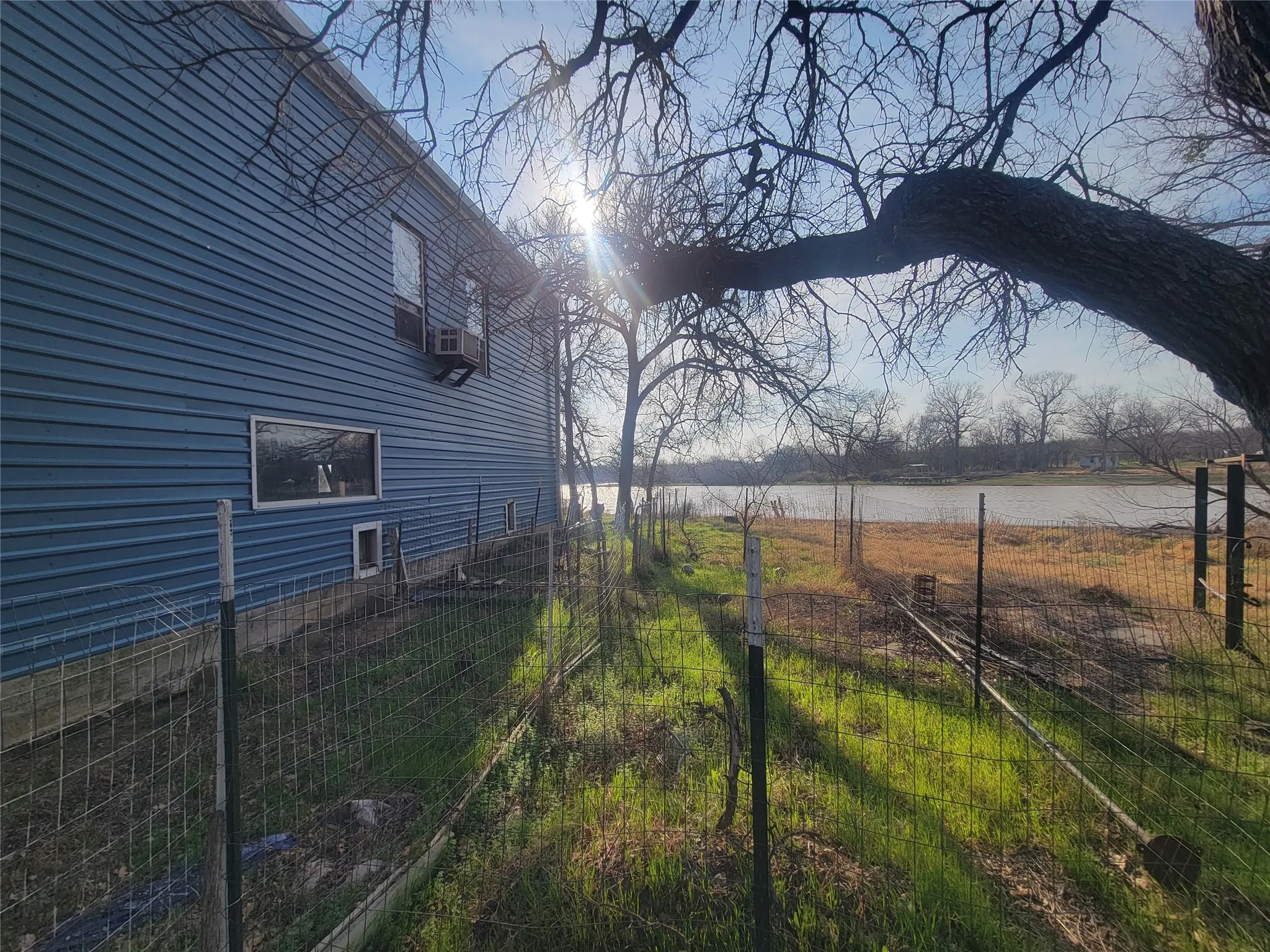 View of yard with a water view