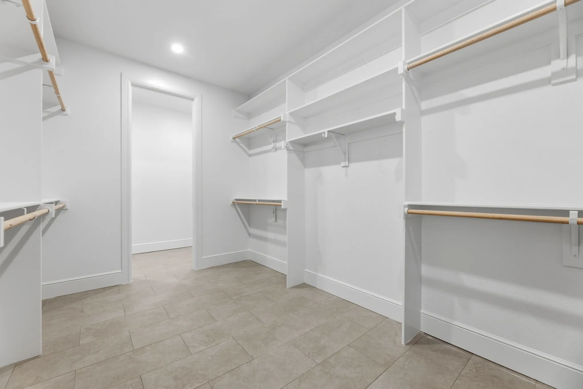 Look at this enormous Walk-in closet with lots of hanging and storage space