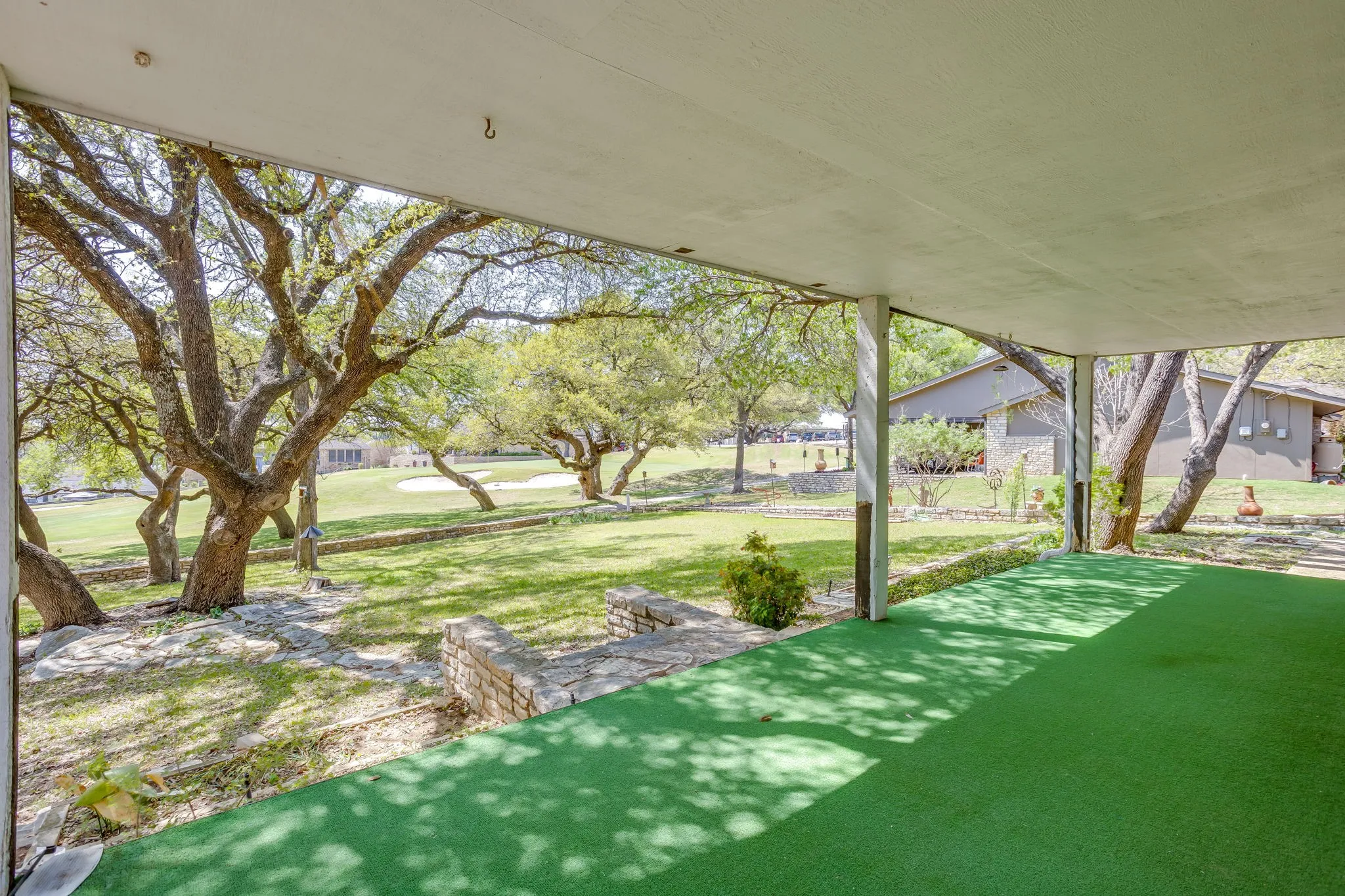 Large covered back porch. Looking toward the 18th hole.