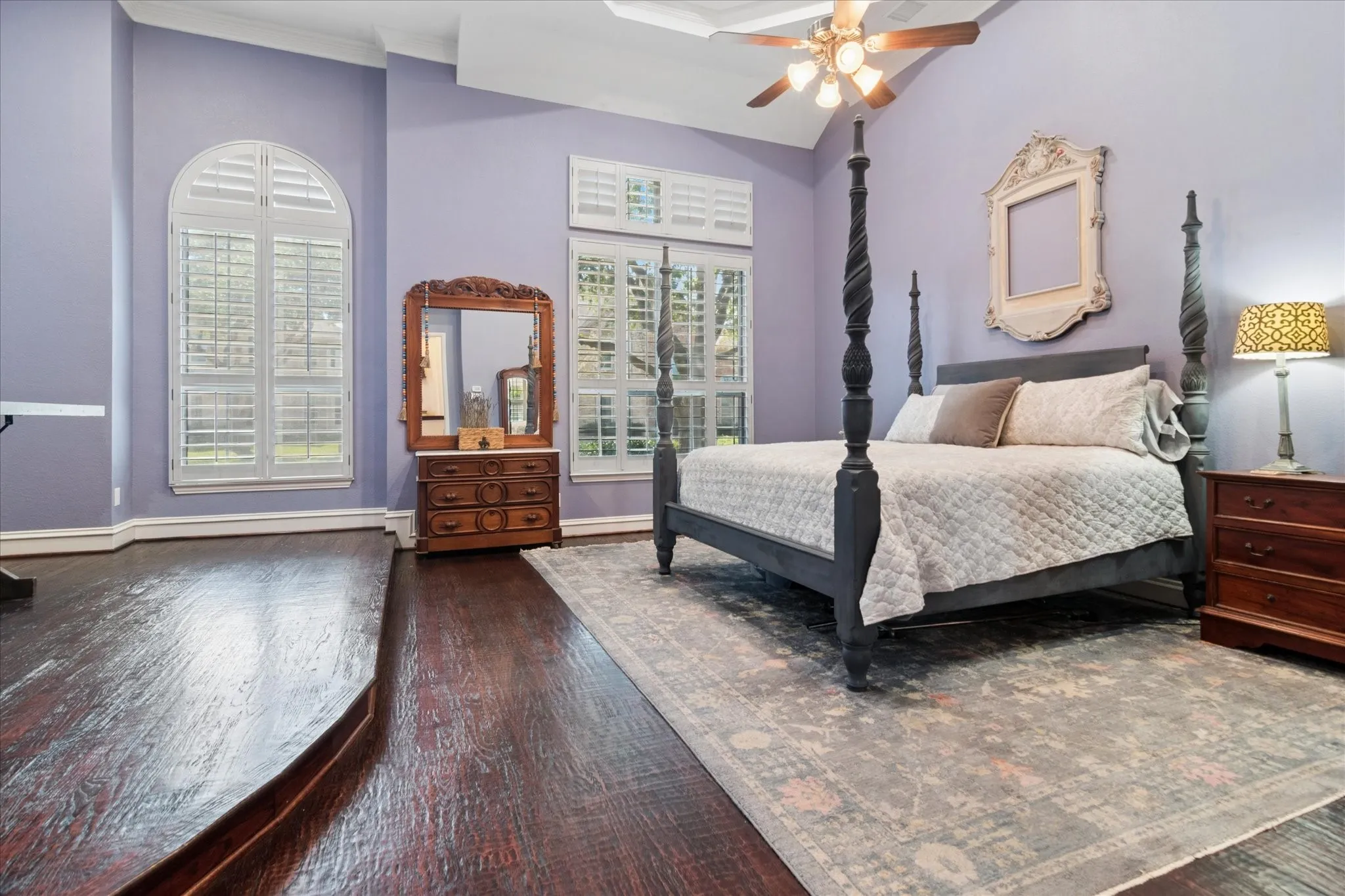 The oversized primary suite serves as a true sanctuary complete with a serene sitting area and spa like bath.