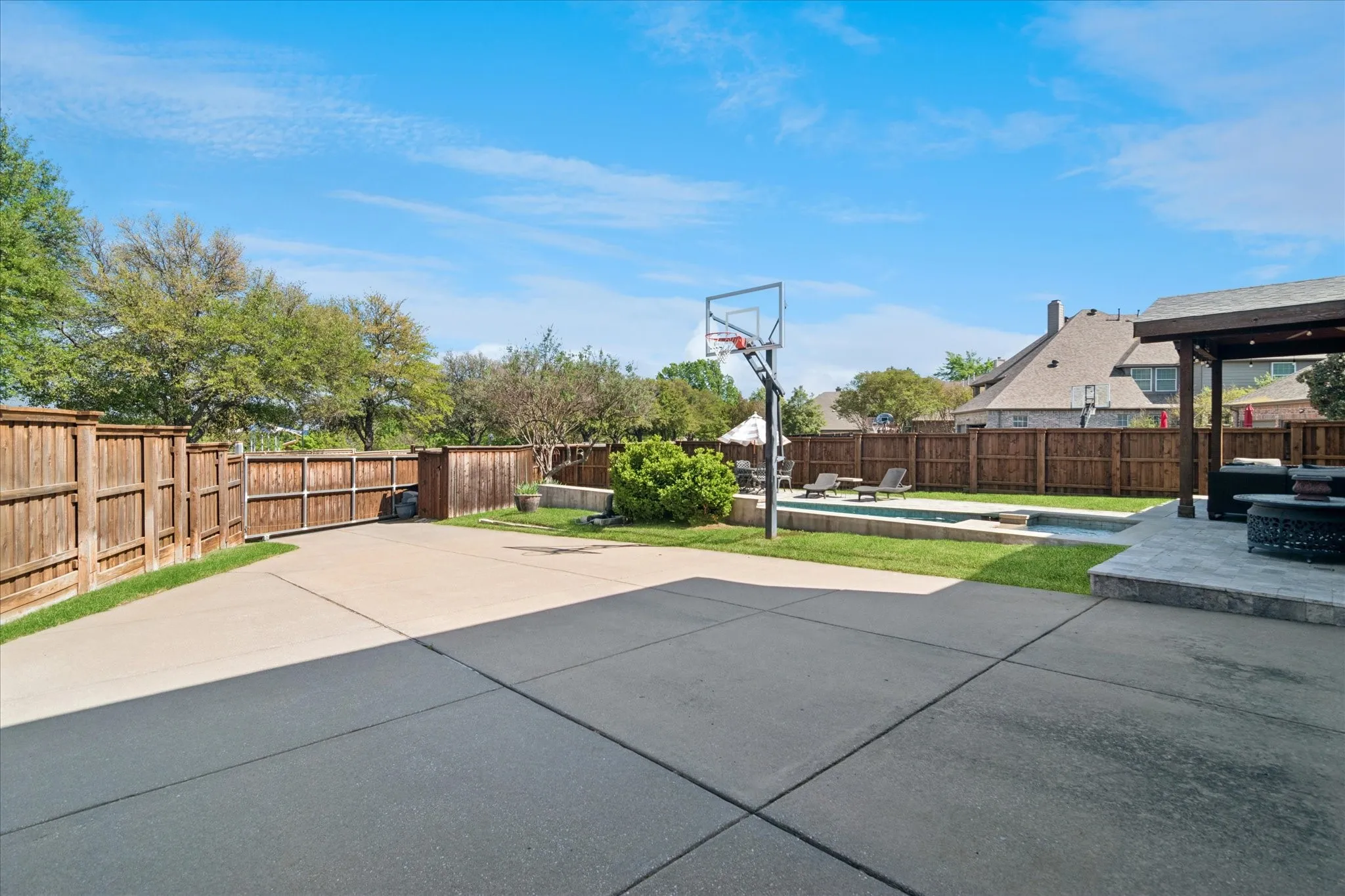  The gated drive provides added privacy and secure additional parking, all enclosed by a cedar privacy fence.