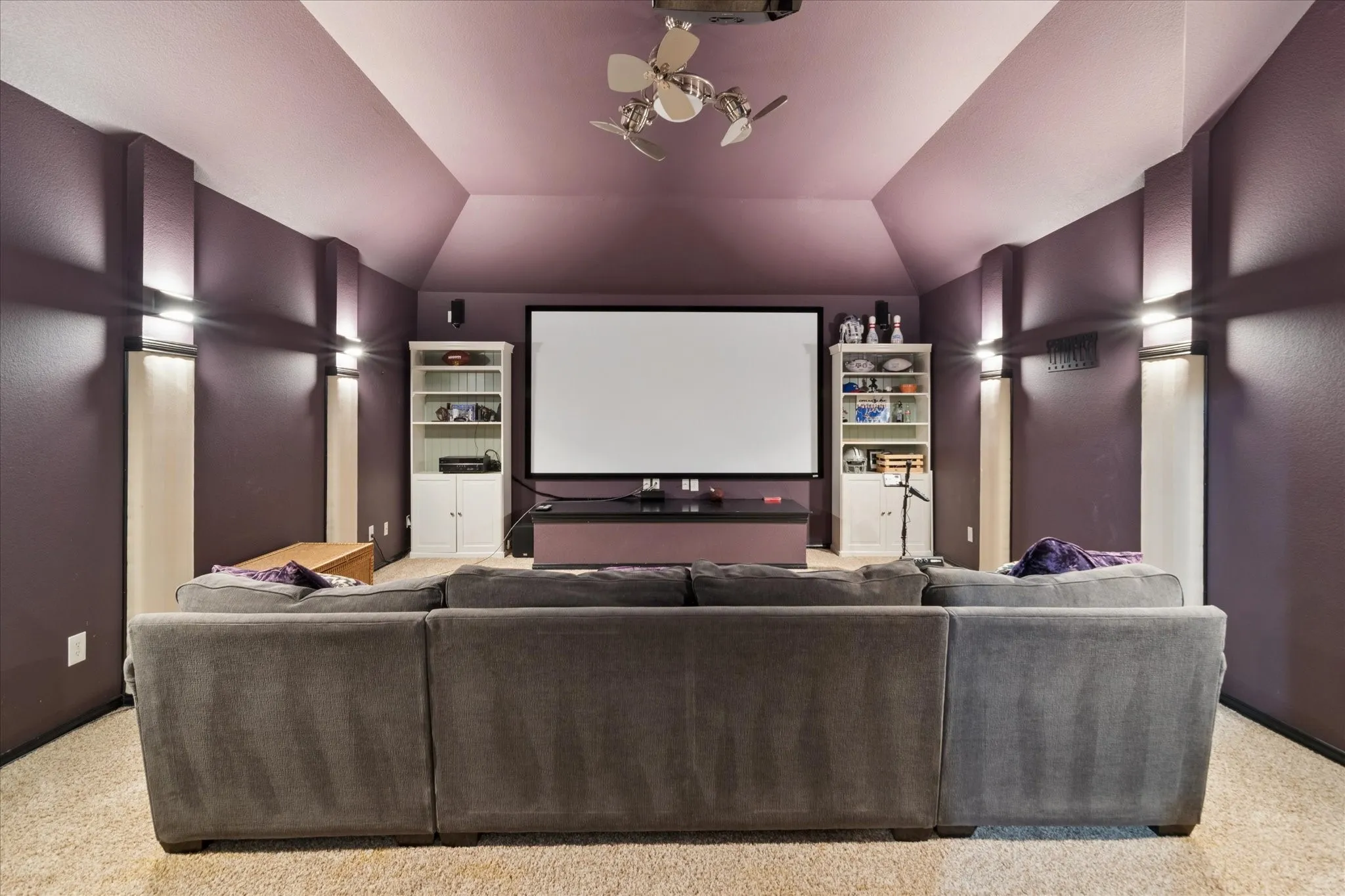 The dedicated media room delivers a true theater experience with a projector and large screen, perfect for movie nights at home.