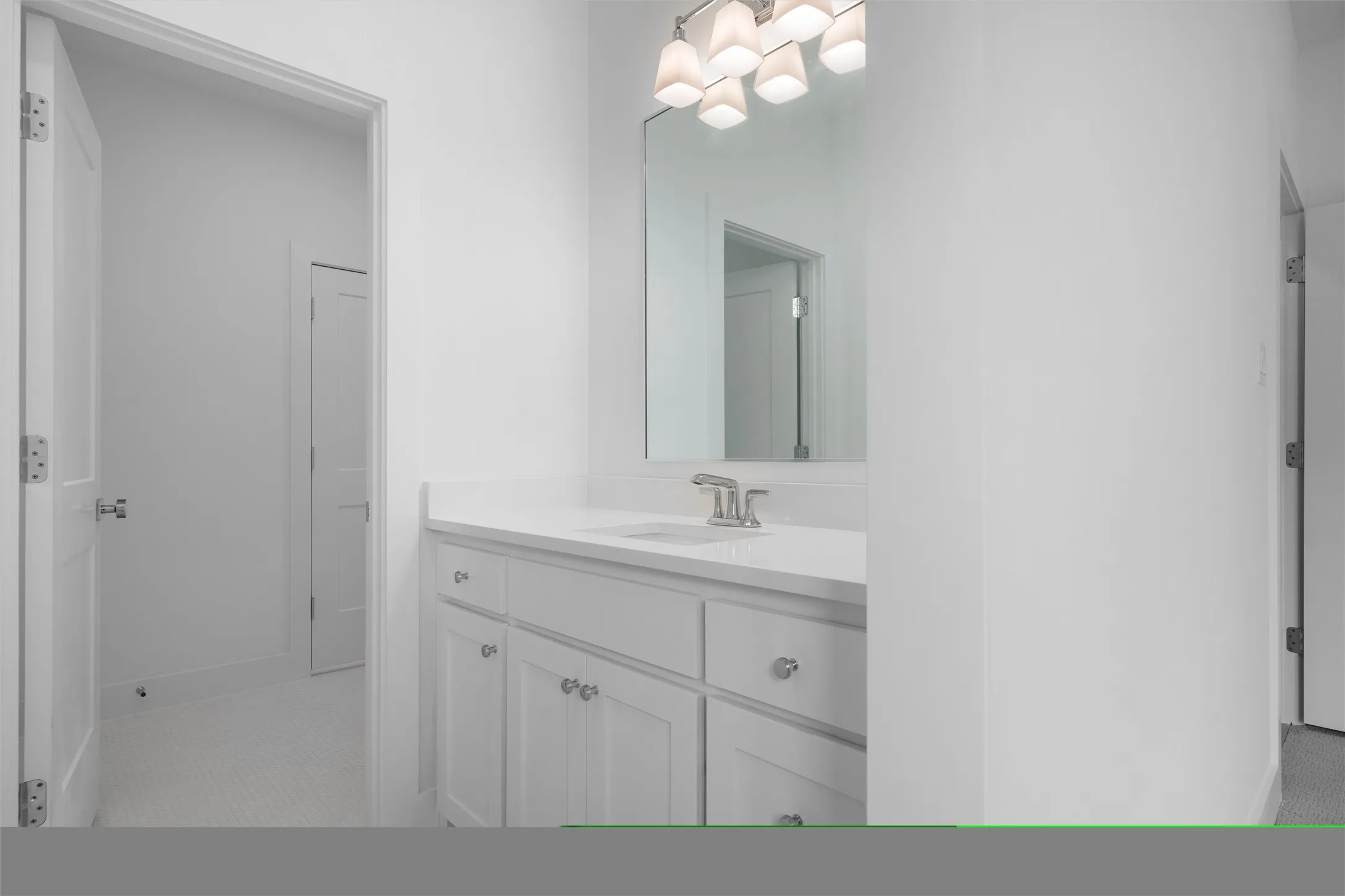Jack and Jill bathroom vanity for upstairs bedroom featuring tile flooring.
