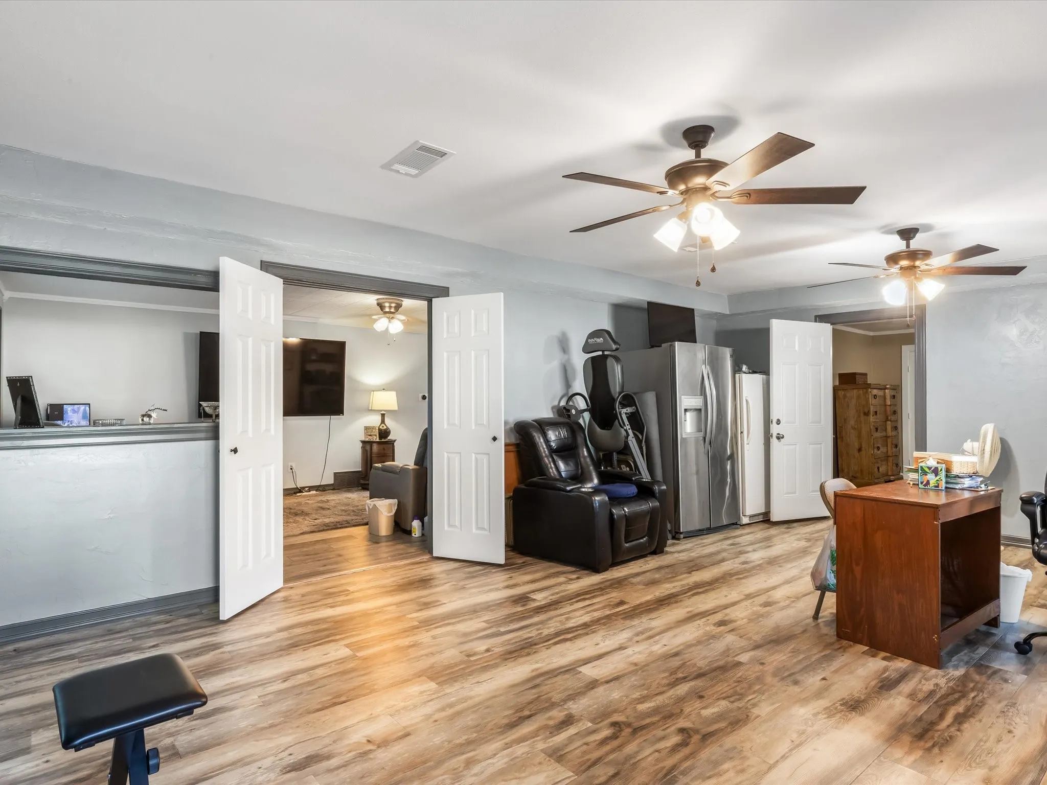 Office featuring wood finished floors and a ceiling fan