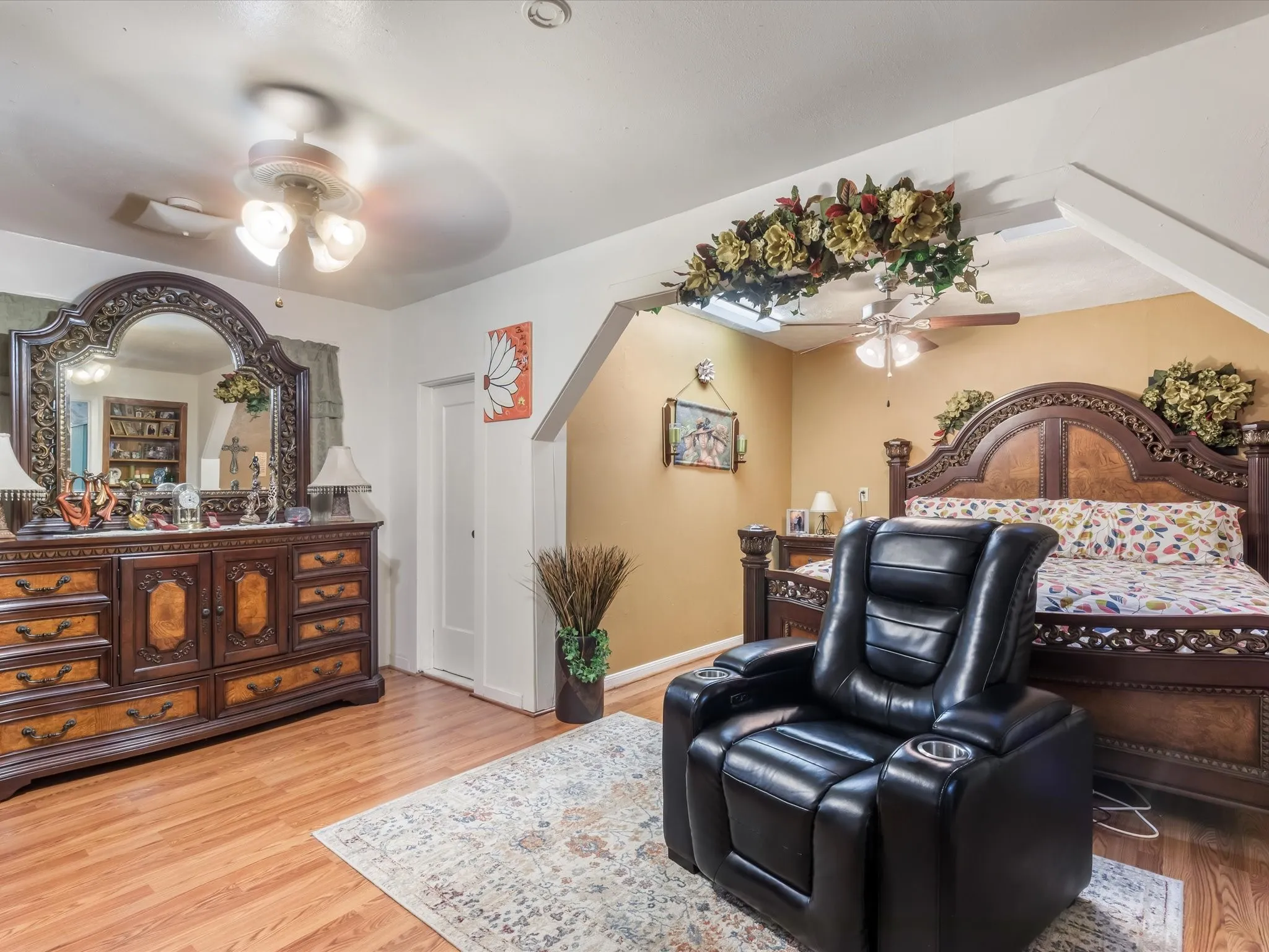 Bedroom featuring light wood finished floors and a ceiling fan